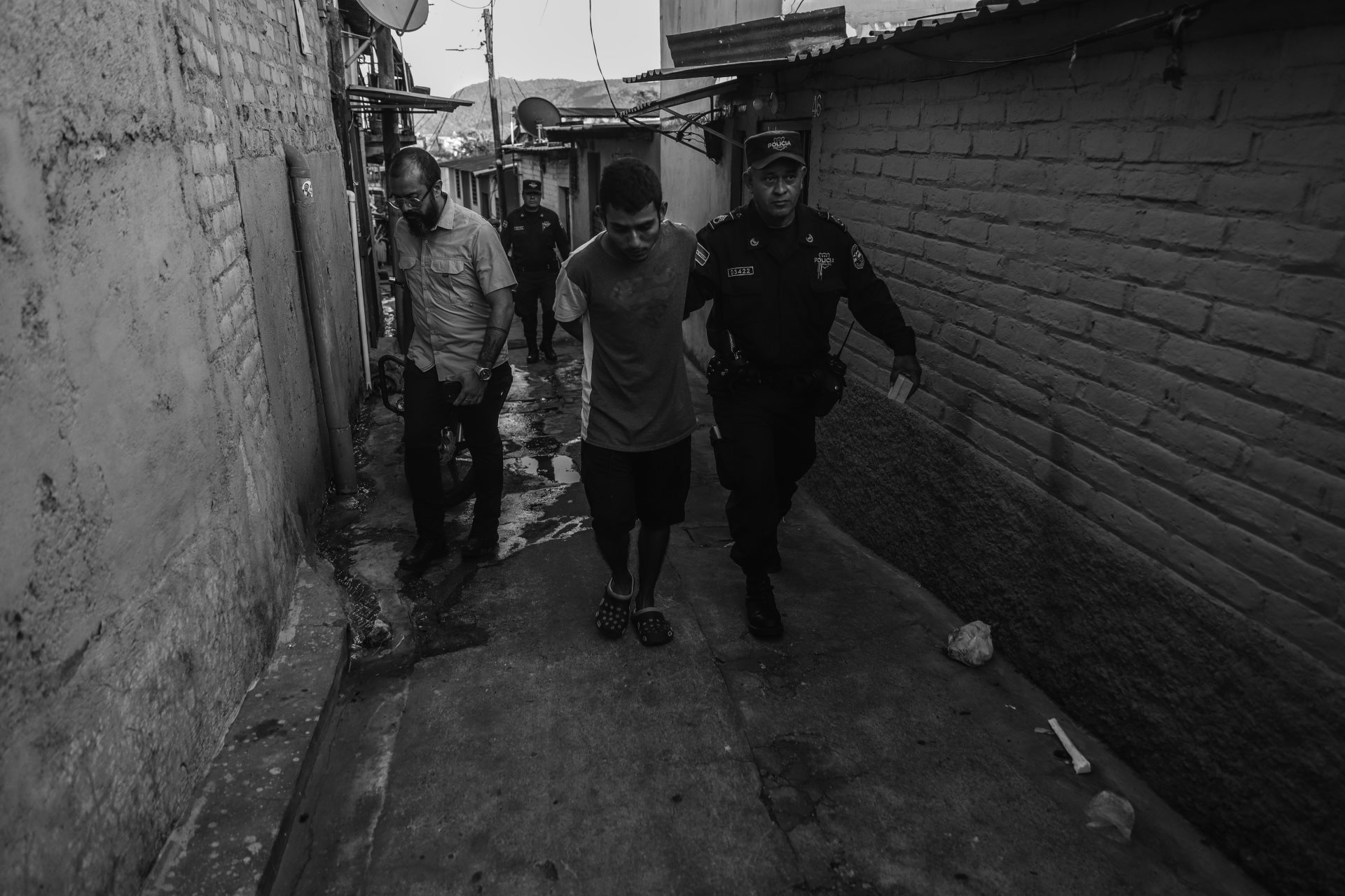 During a police operation, a young man is taken into custody. A small amount of marijuana was found in his possession. Despite lacking demonstrable connections to criminal organizations, he was categorized as a gang member. San Salvador, El Salvador.