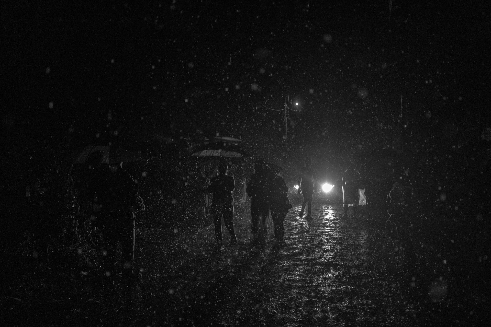 Dozens of people wait in the rain for information about their captured relatives around Izalco jail. Some people travelled for hours and slept in the street because they live hours from the jail. Even now, three years later, some are still looking for relatives captured during the first days of the &ldquo;state of emergency.&rdquo; Izalco, El Salvador.
