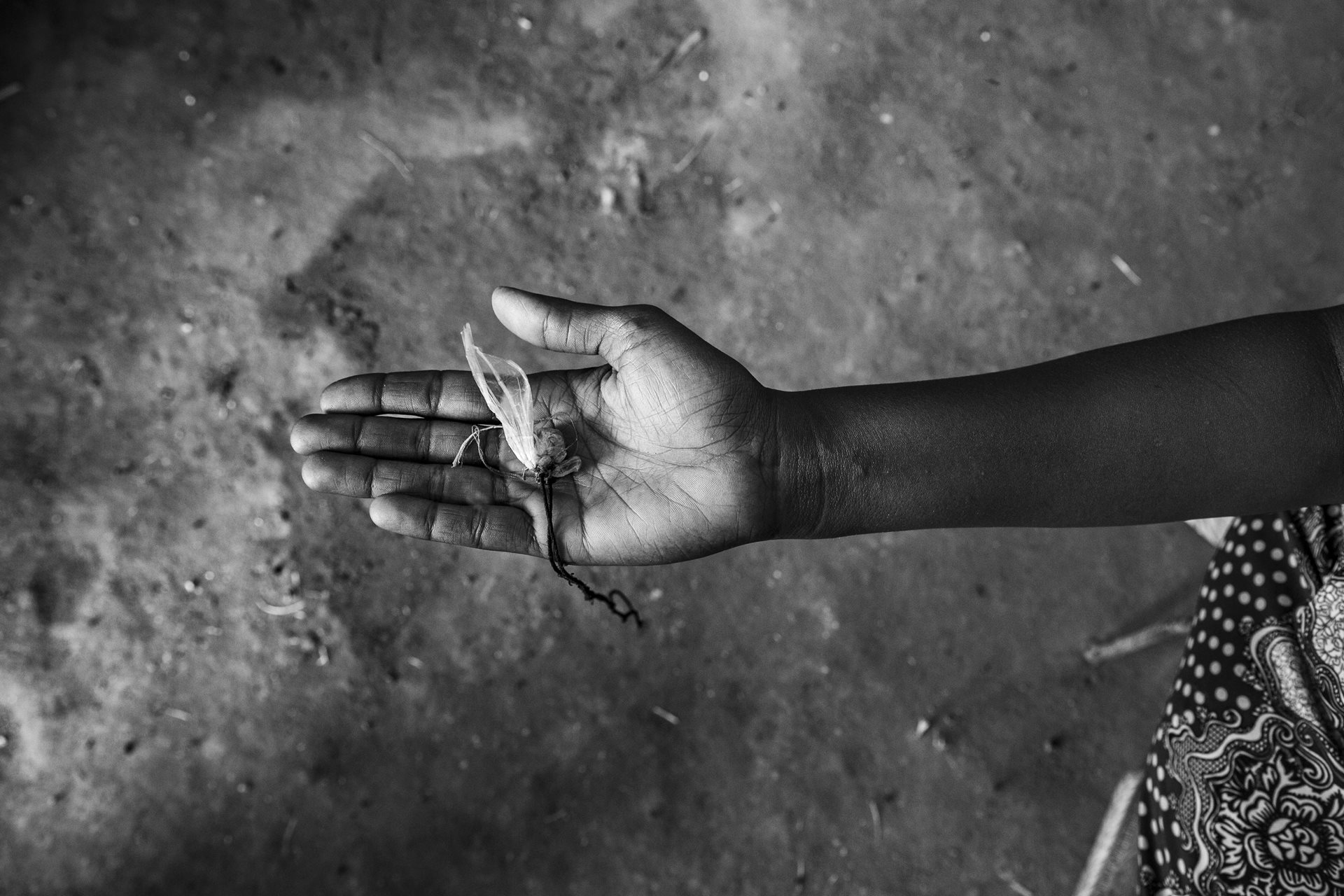 A Tigrayan woman holds a religious pendant belonging to her husband, who went missing during the conflict in Tigray. She says, &ldquo;It is the only thing left of my past life.&rdquo; When the bombing started, her husband joined the army. She has not heard from him since. Today she lives in poverty, supported by the aid provided within the Um Rakuba refugee camp, Gedaref, Sudan.<br />
&nbsp;