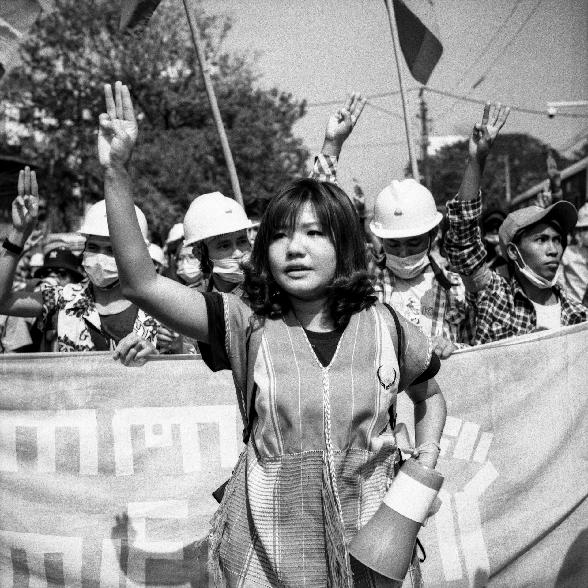 Ei Thinzar Maung, a political ac​tivist, is seen protesting alon​g with a labor union in Yangon, Myanmar. Maung later joined the parallel Myanmar government in exile, and was mentioned in the TIME Top 100 most influential people of 2021 list.