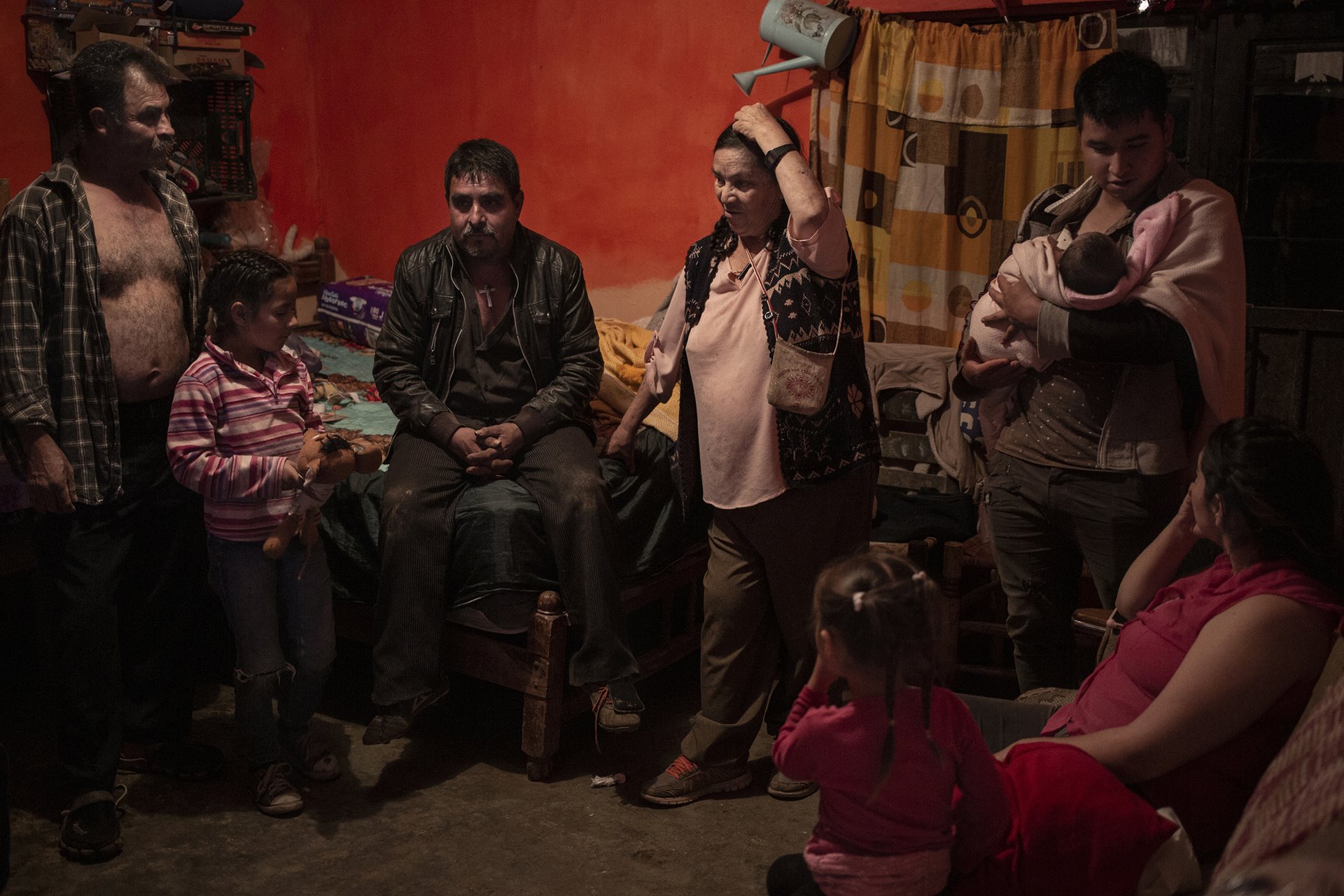 A family gathering at the home of Don Tino (far left) and Doña Petra (center), in Villa Guerrero, Mexico. They are parents to 18-year-old Sebastián (not pictured), who was born with hydrocephalus, a neurological disorder caused by a build-up of fluids in cavities within the brain.