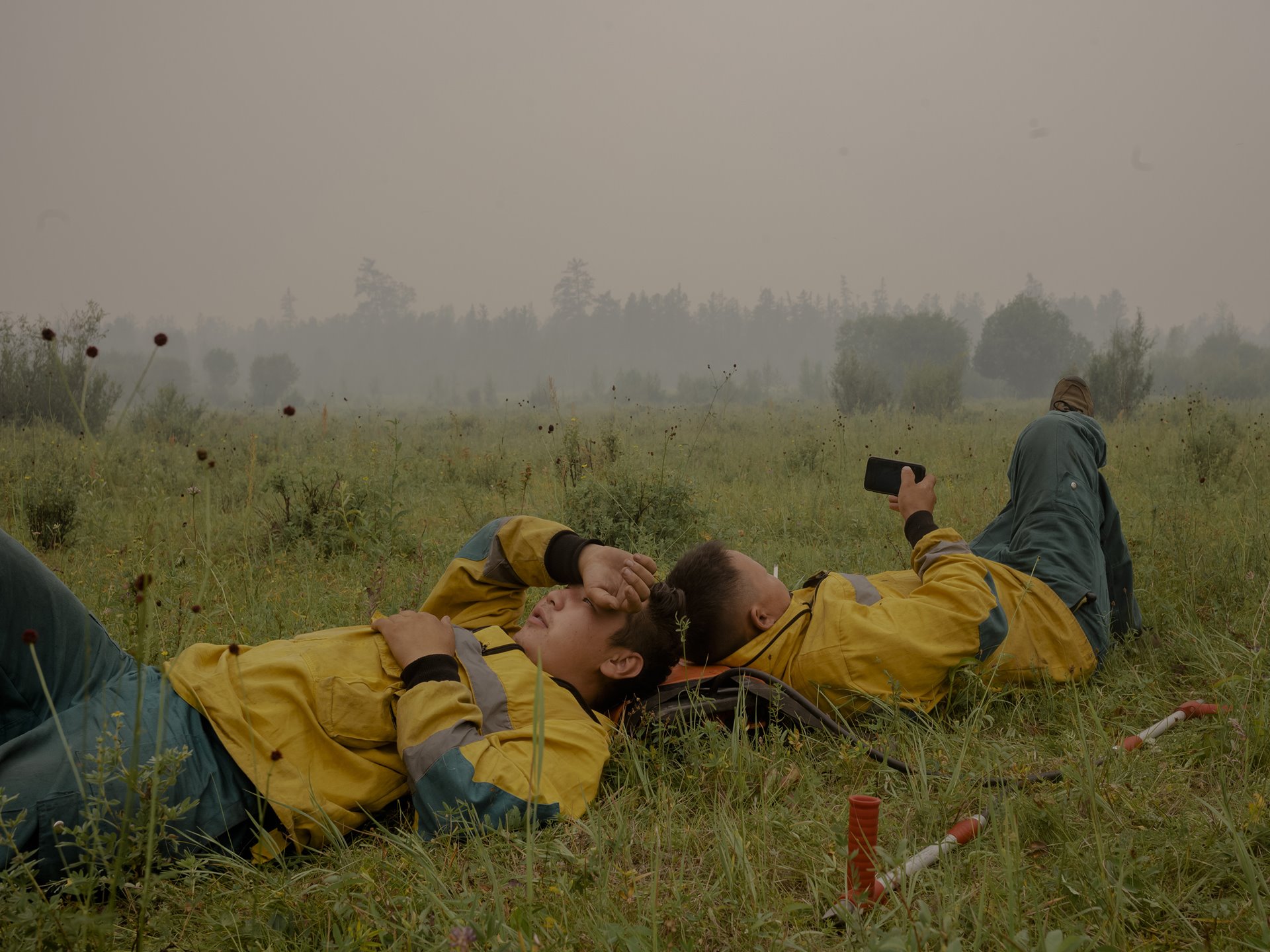 Firefighters take a break in Magaras, central Sakha, Siberia, Russia