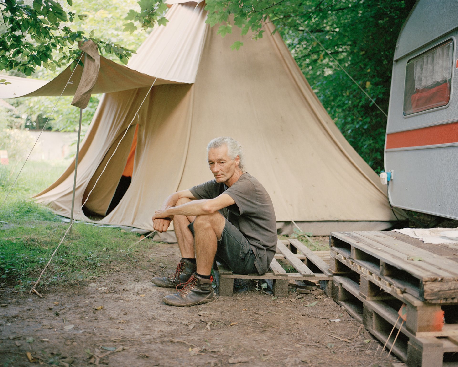 &ldquo;Fred&rdquo; sits on a pallet in front of the tepee in Lützerath, Germany, where he often spends the night. Together with many other local activists, he campaigned for the preservation of the village. Activists in Lützerath use assumed names as they fear police reprisals.