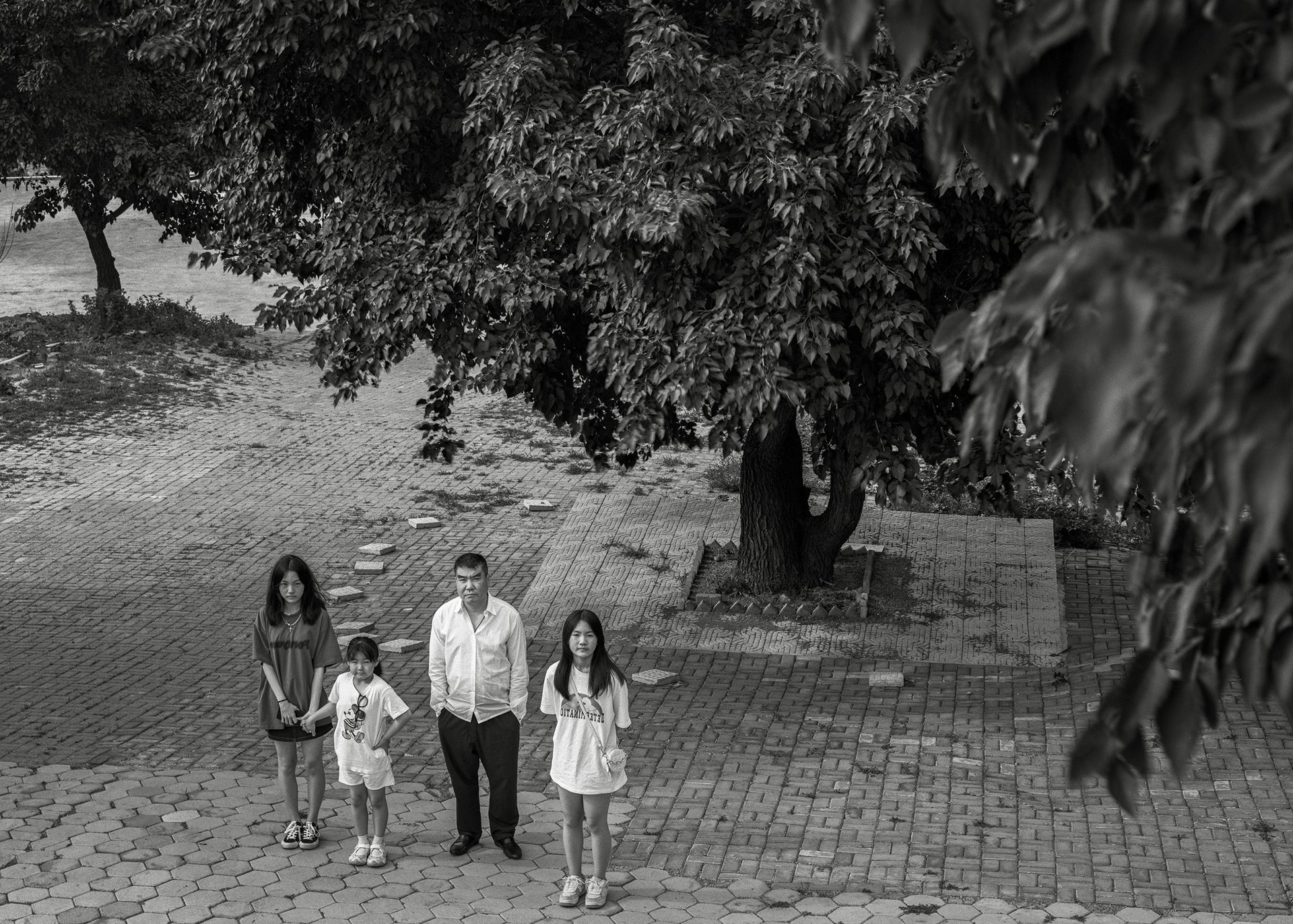 The children&rsquo;s father takes them to the cemetery a month after Jiuer passed away. As Jiuer once said: &ldquo;We are still with each other.&quot; Liaoning, China.