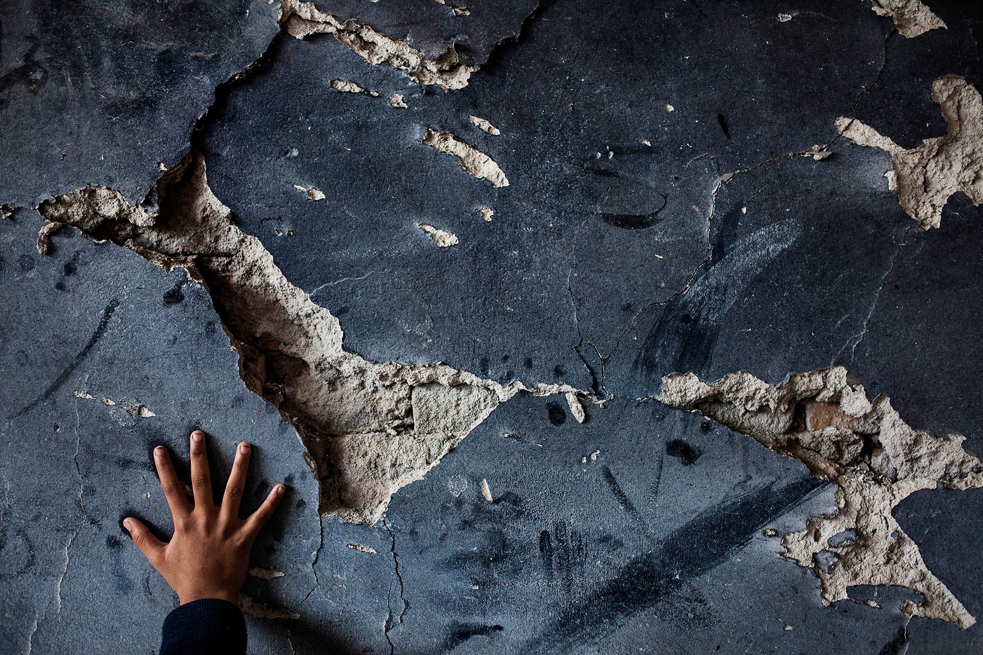 A student&rsquo;s hand in a classroom at a school in Swabi, Khyber Pakhtunkhwa, Pakistan, where two rooms were destroyed in a Taliban attack in August 2012.