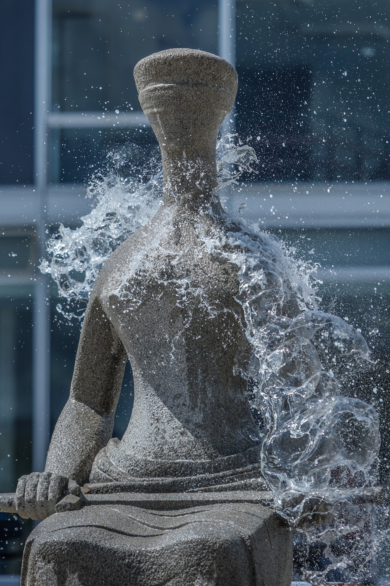 <em>The Justice</em>, a statue by Alfredo Ceschiatti in front of the Brazilian Supreme Court, is washed after being vandalized, in Brasilia, Brazil. Restoration of the federal buildings began after more than a thousand people were arrested in the days following the protests.&nbsp;