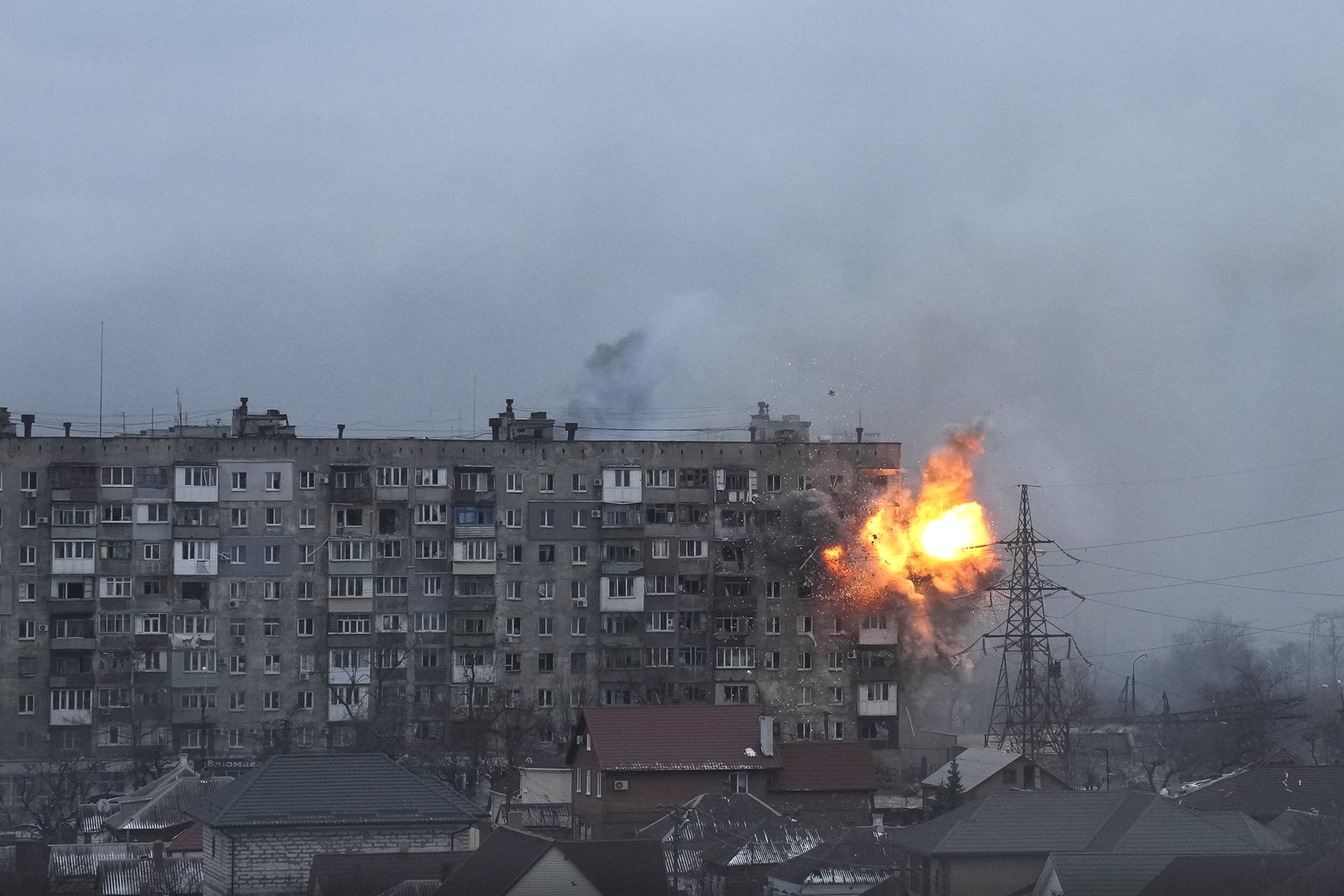 <p>An explosion erupts from an apartment building on Mytropolytska Street, Mariupol, Ukraine, after fire from a Russian army tank. Two elderly women, Lydya and Nataliya, who could not make it down to the basement to shelter, were killed in the attack.</p>
