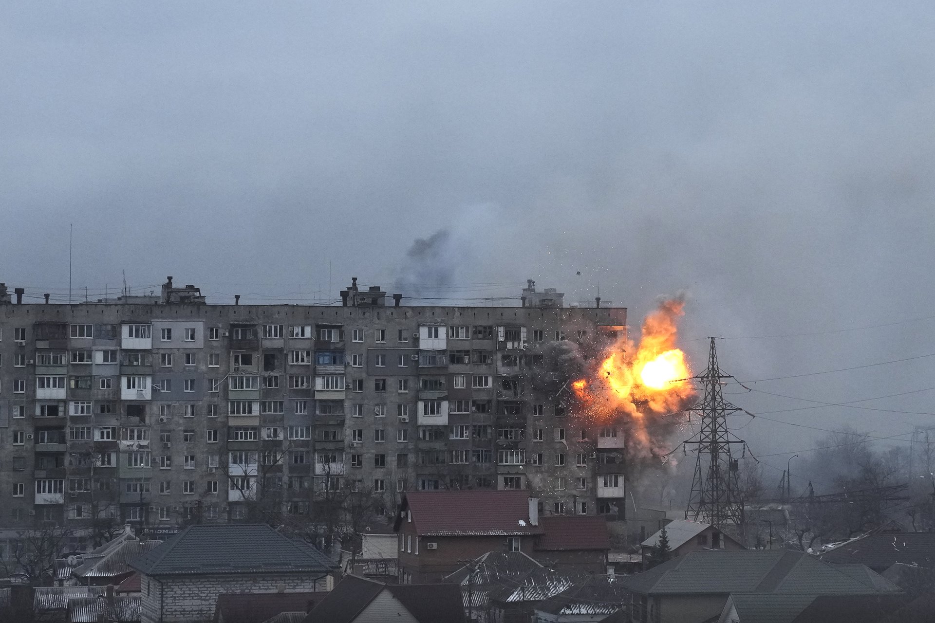 <p>An explosion erupts from an apartment building on Mytropolytska Street, Mariupol, Ukraine, after fire from a Russian army tank. Two elderly women, Lydya and Nataliya, who could not make it down to the basement to shelter, were killed in the attack.</p>
