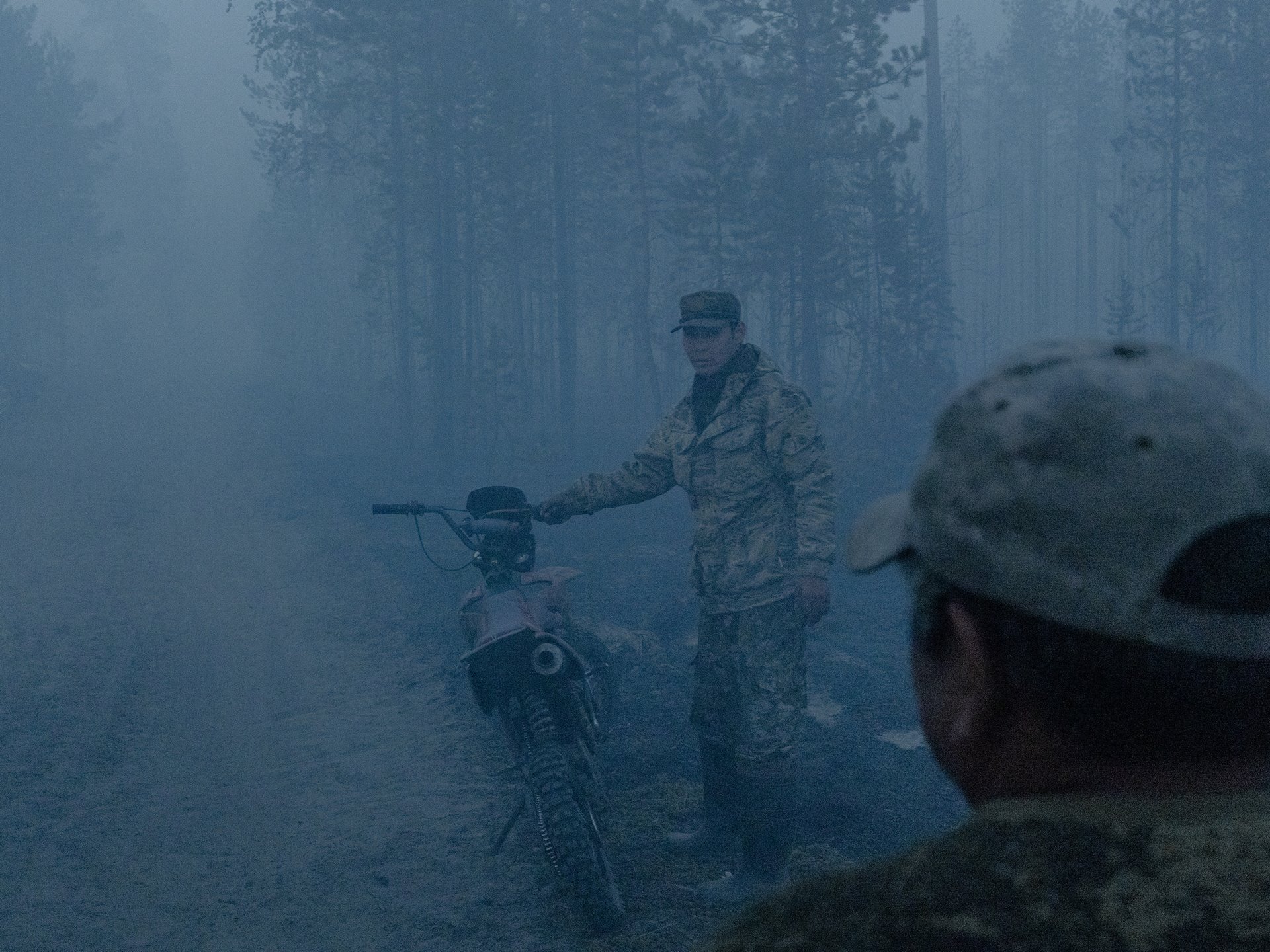 Local firefighting volunteers check the size of a forest fire, in Kürelyakh, Sakha, Russia. The size of the fire becomes discernible only at night, when humidity calms it down a little.