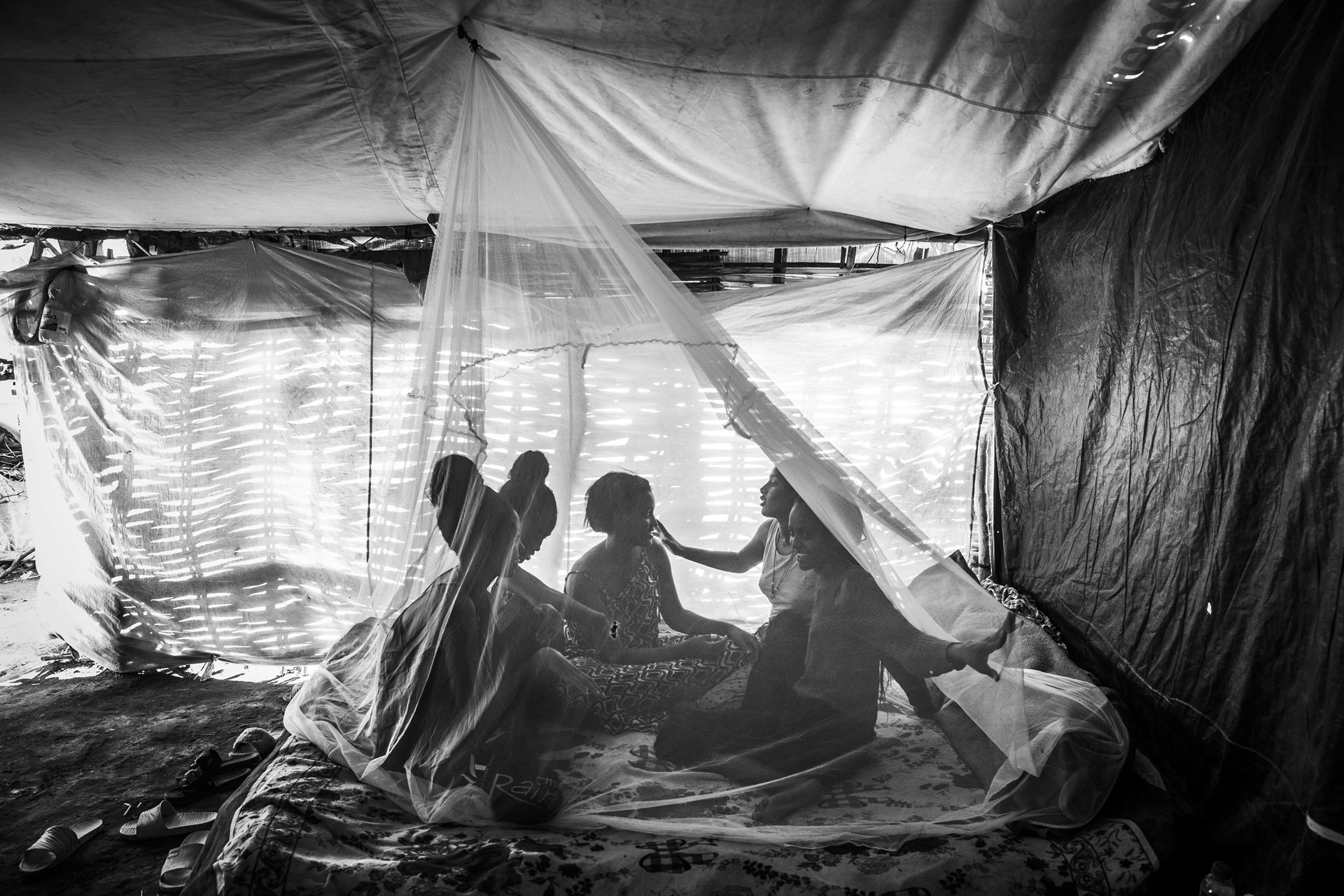 Despite experiencing trauma, the girls find strength and support in their shared experiences, fostering resilience, self-confidence, and collective strength at Um Rakuba Refugee camp, Gedaref, Sudan.