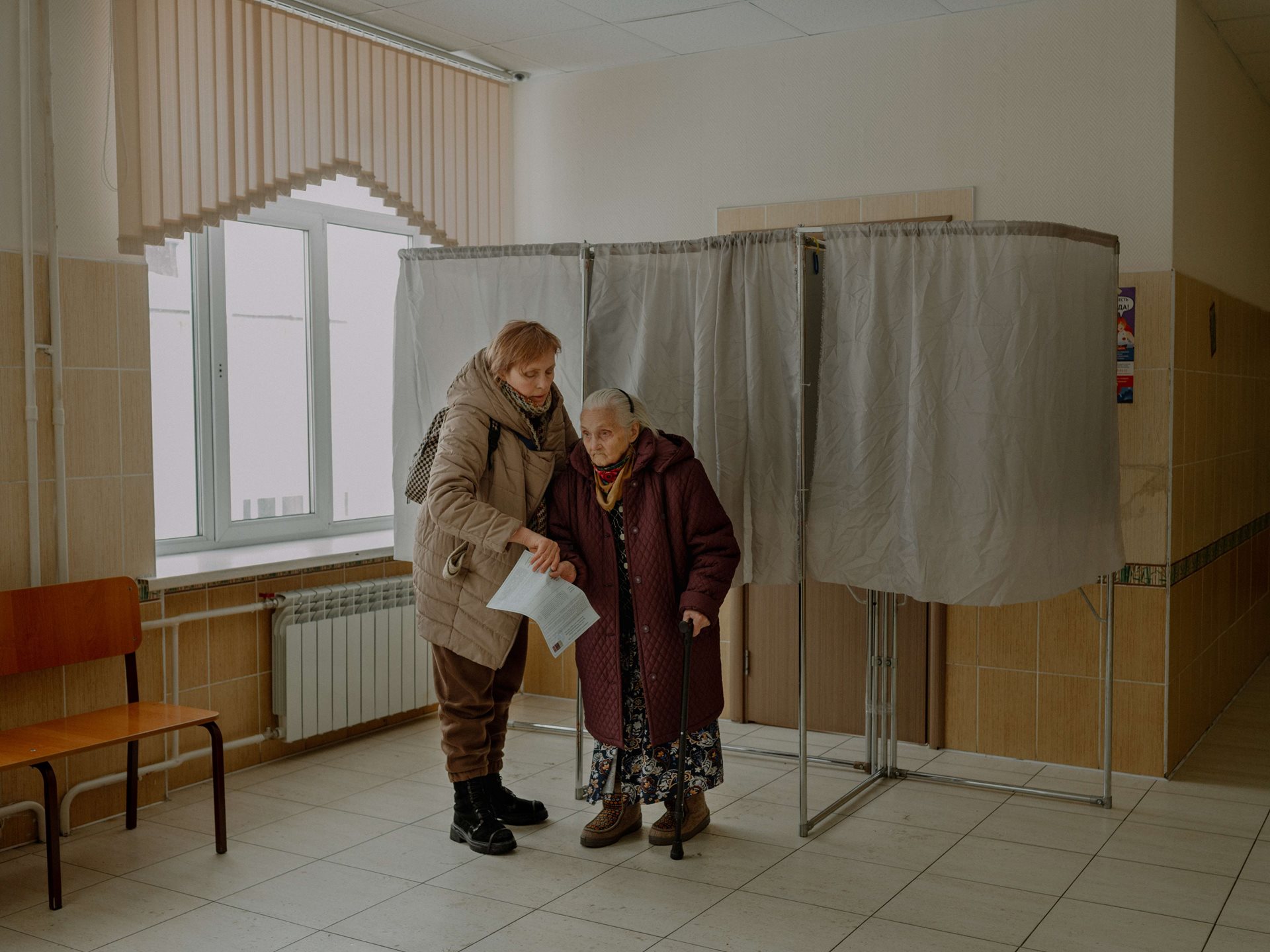 At the age of 94, Aliona&rsquo;s grandmother votes for the president, in Tomsk, Russia. She says: &rdquo;God bless me, old fool, that I can vote for Putin one more time!&rdquo;