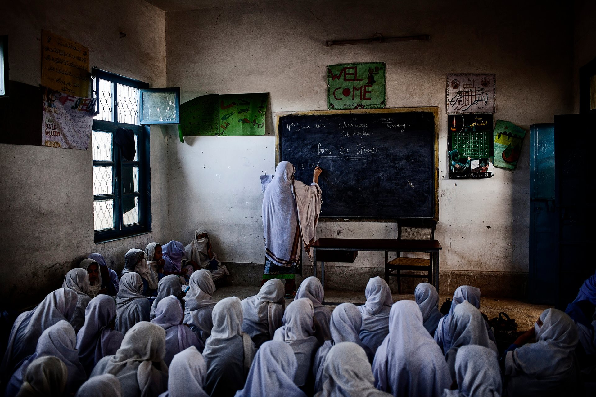 Female students attend class at their school, which was attacked by the Taliban on 21 December 2012 as part of a campaign to prevent girls from accessing education. Swabi, Khyber Pakhtunkhwa, Pakistan.