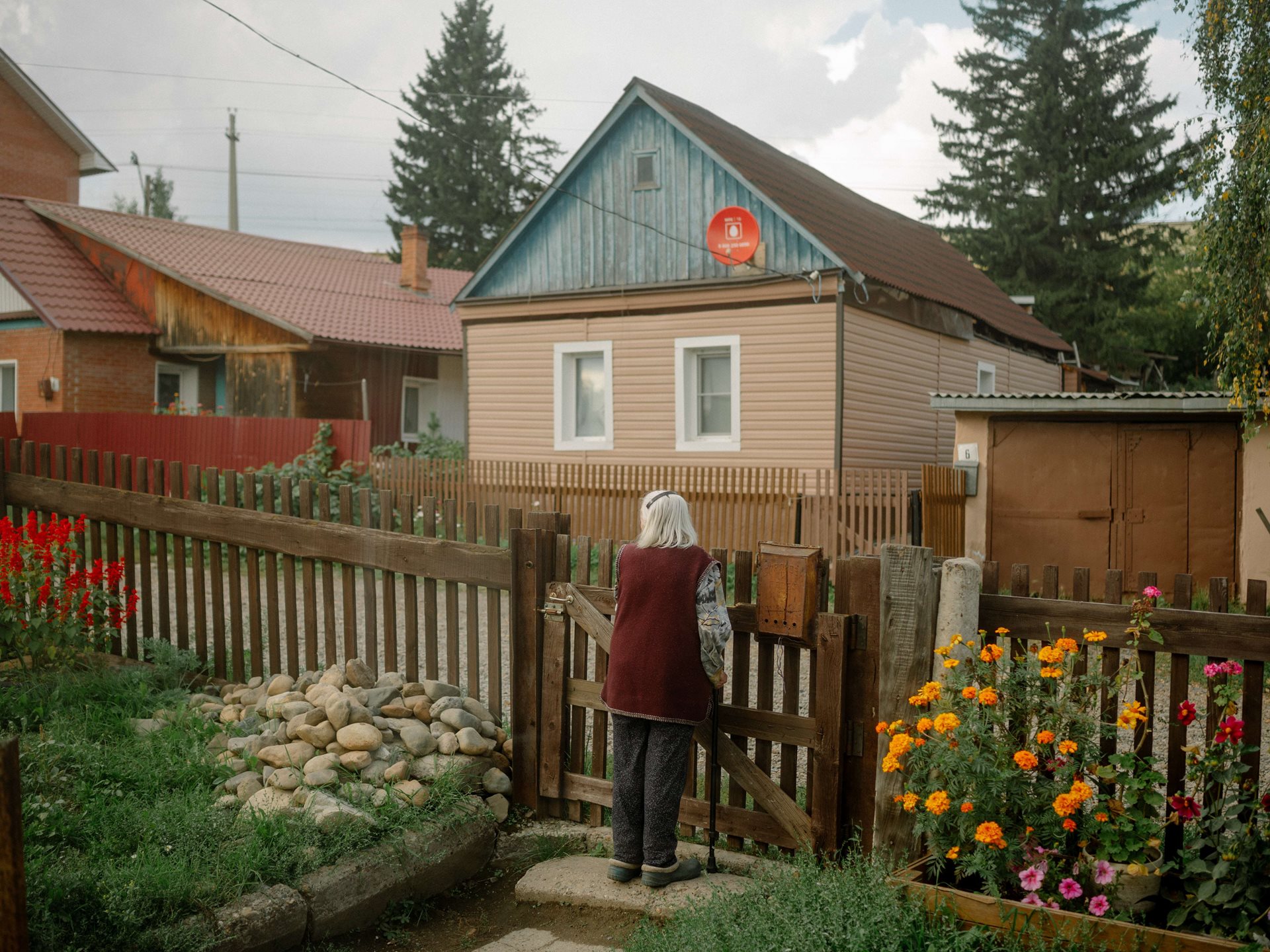 Aliona&rsquo;s grandmother stands at the gate of the family home in Tomsk, Russia. She is 95, and lived in a small village all her life, until moving to a one-room apartment in Tomsk five years ago. She loves her new home, but Aliona&rsquo;s parents&lsquo; house reminds her of a past she misses.&nbsp;<br />
&nbsp;