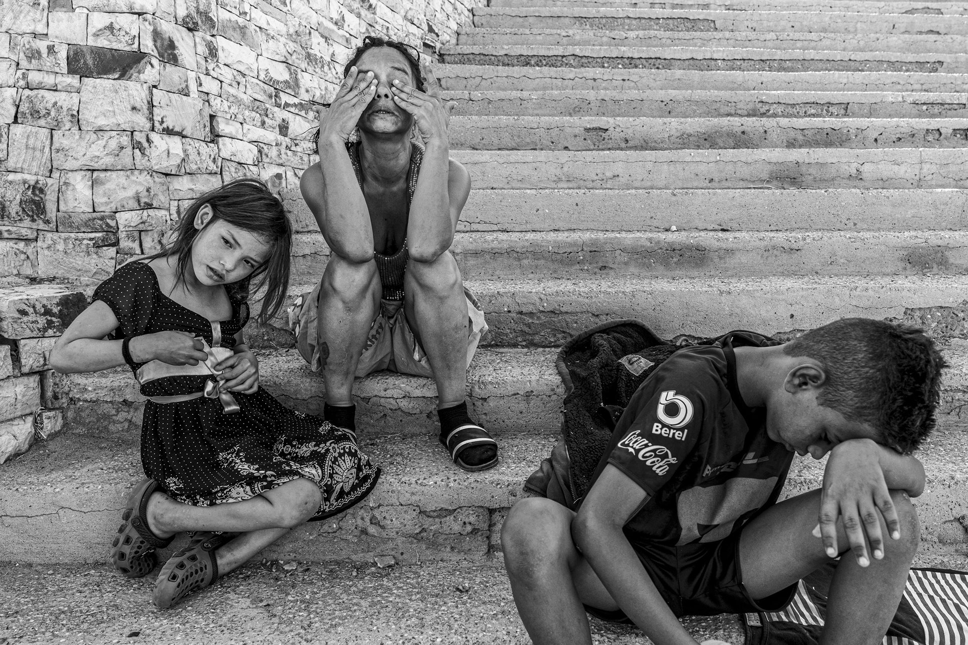 Gladys Titeo cries after waking up at Parque Público Federal El Chamizal in Ciudad Juárez, Mexico. Gladys&rsquo;s family lives in the park as they await news about their asylum hearing on the glitchy CBP One app. Migrants at the park sleep outdoors, facing the summer desert heat, which can reach up to 40 degrees Celsius in the day.