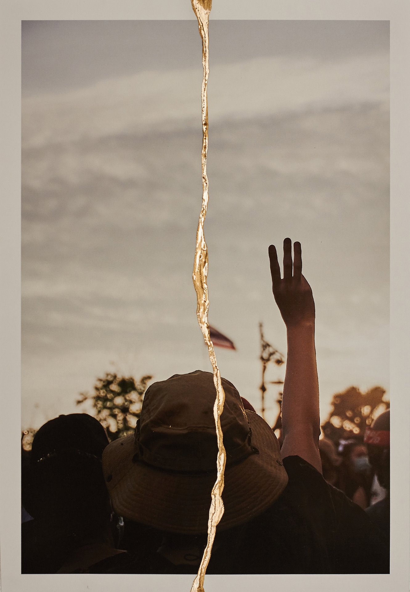 A protester makes a three-finger salute - popularized by the Hunger Games films - in Bangkok, Thailand.&nbsp;<br />
<br />
In the films, the salute is a sign of resistance against the authoritarian regime, which drew comparisons with Thailand&rsquo;s military government. Authorities canceled screenings of the films and arrested people performing the salute. Students in many schools all over the country express their political opinions by performing this salute during the national anthem, which is played by televisions, radios, and loudspeakers across the country daily at 08:00 and 18:00.