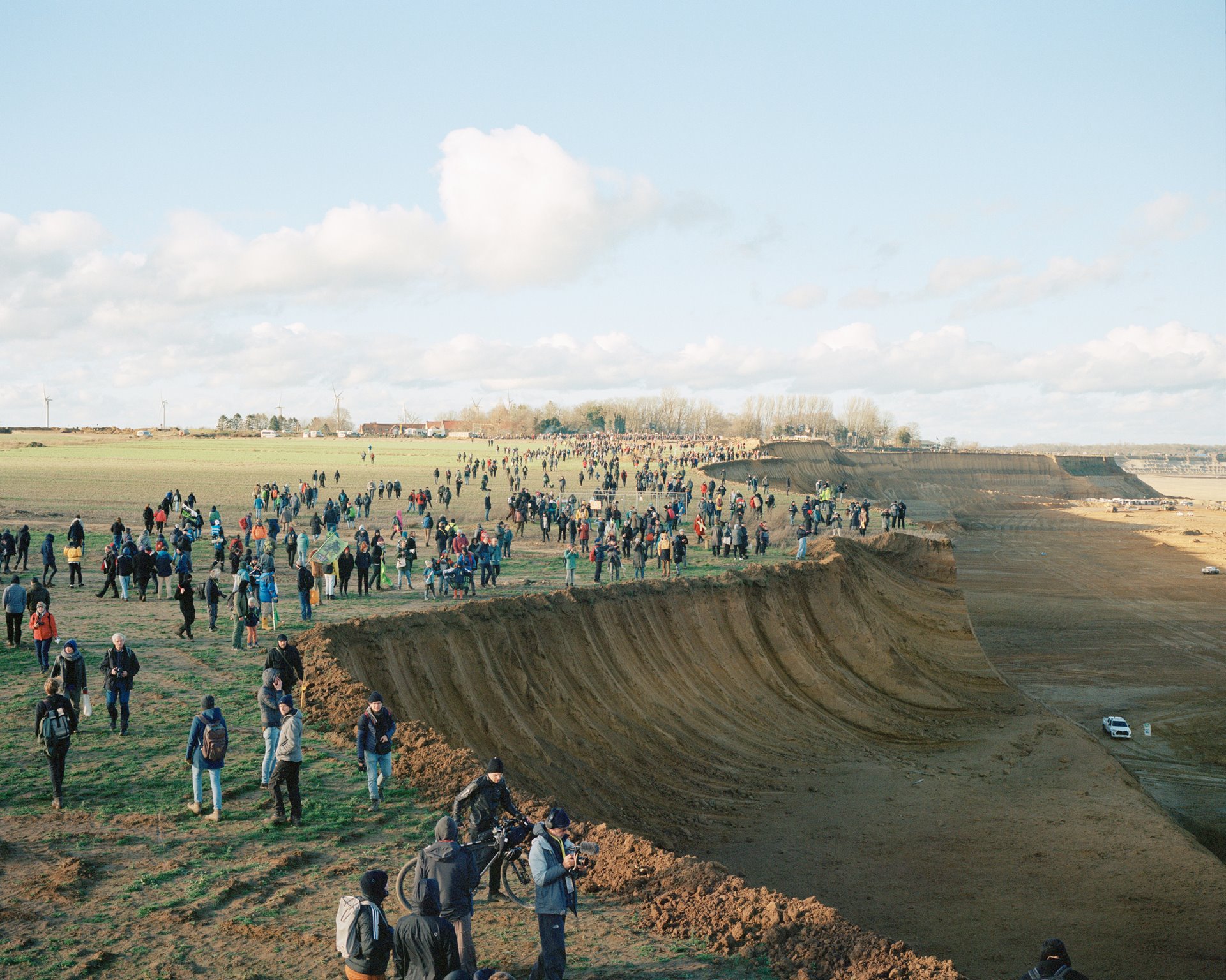 Demonstrators walk along the advancing edge of the Garzweiler II open-pit mine near Lützerath, Germany, on the last weekend they could legally enter the village.