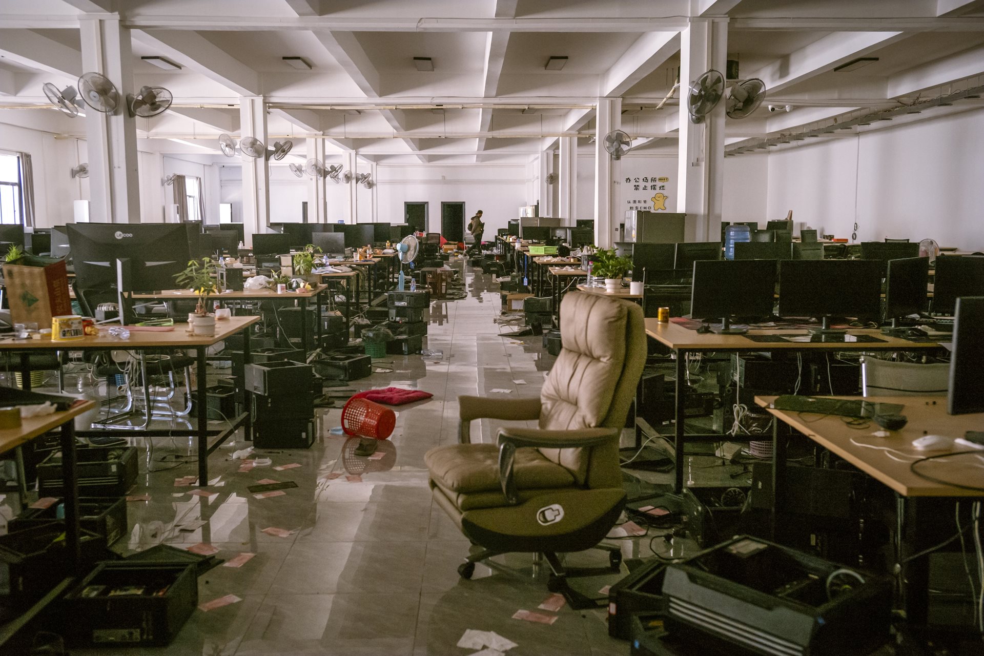 Offices in Shunda Park were left in disarray after a surge of fighting between the Myanmar military and the opposition militia nearby. Some parts of the complex resembled professional executive suites; others trapped workers in a &ldquo;Sisyphean loop&rdquo; of 12-hour shifts. Min Let Pan, Myanmar.