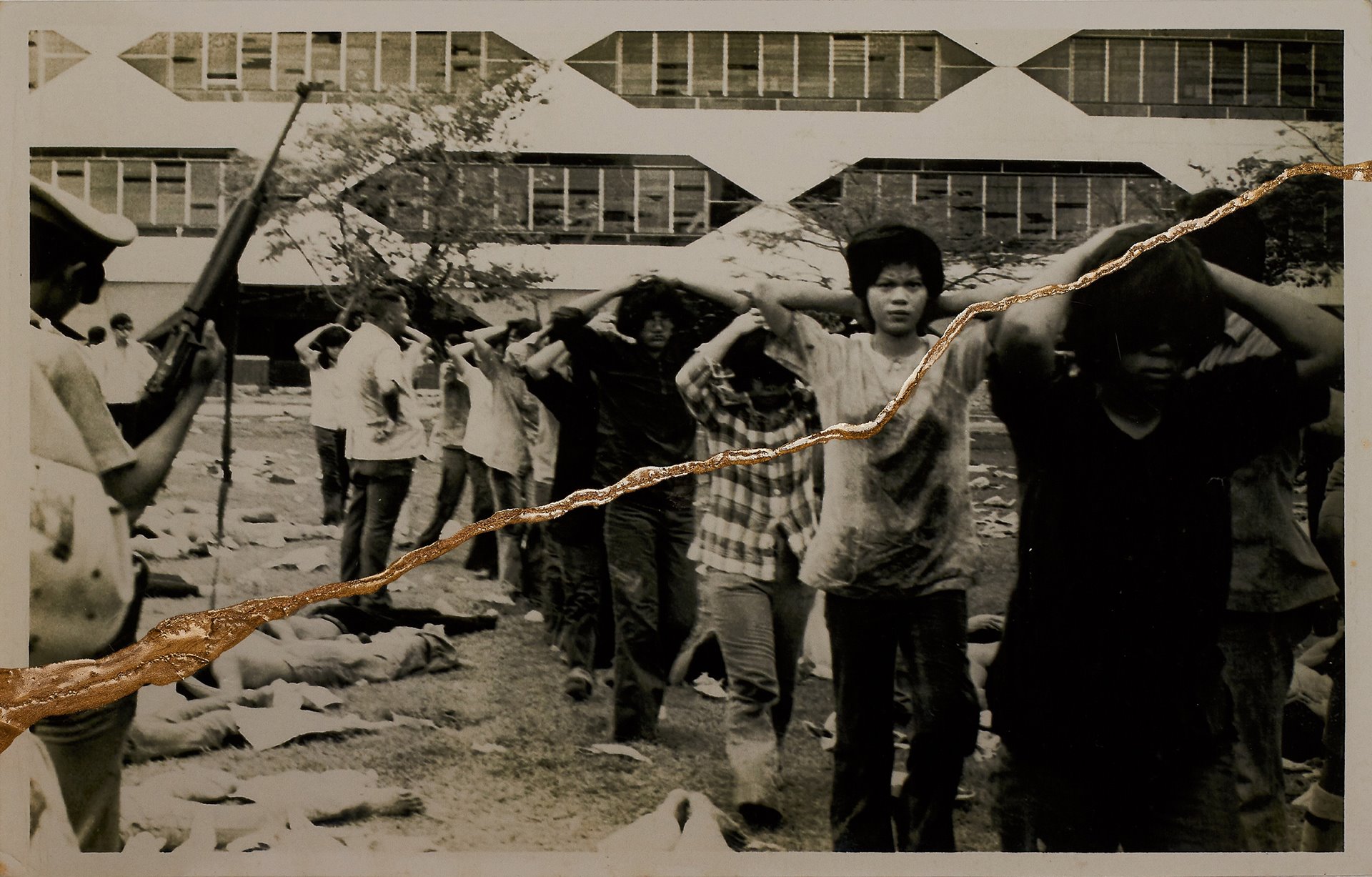 Student protesters surrender during the 6 October 1976 massacre at Thammasat University, Bangkok, Thailand.