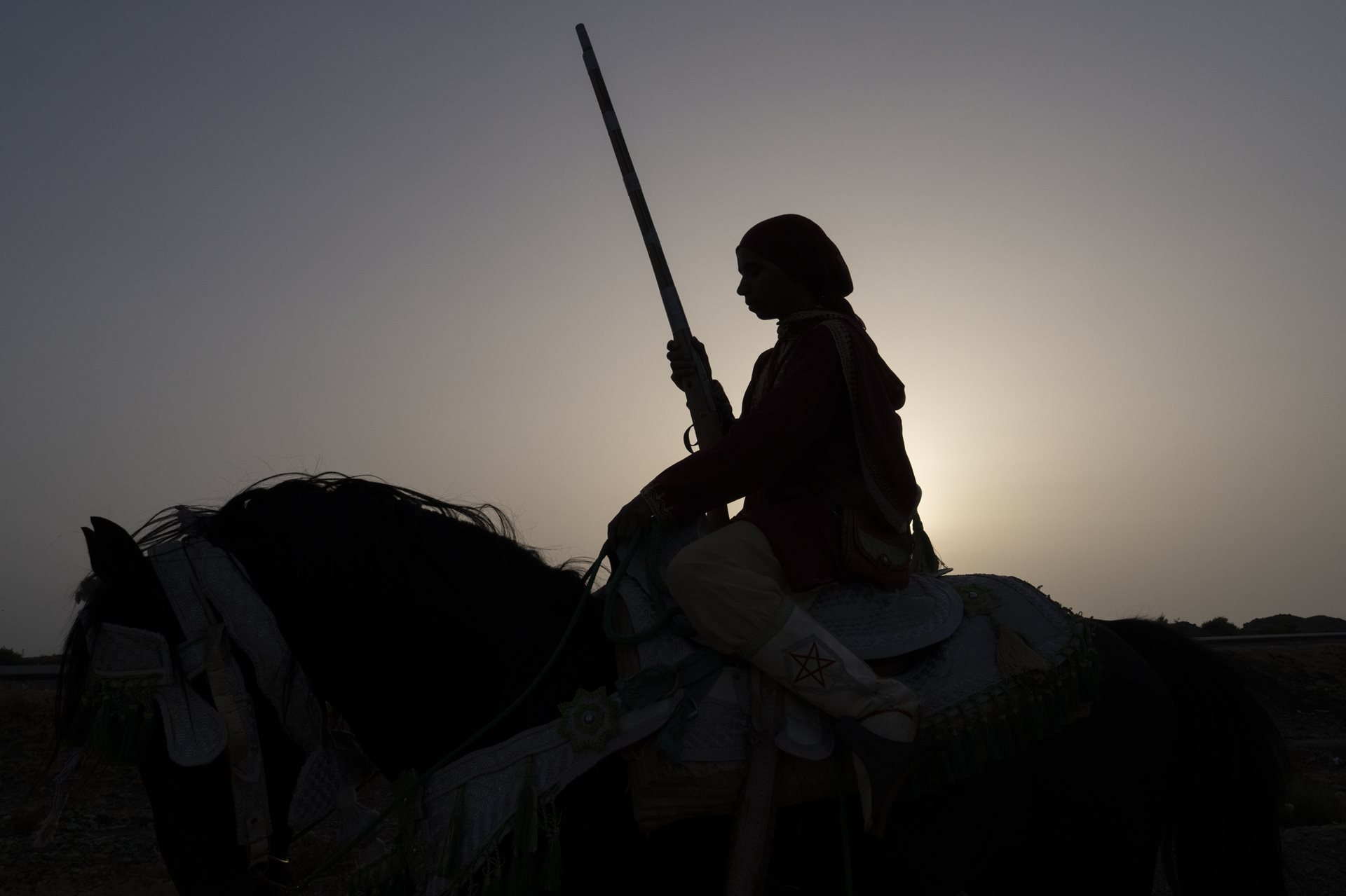 Ilhad Talid during a training session in Marrakesh, Morocco. Tbourida demands years of practice; riders must gallop in unison while loading and firing a rifle, requiring exceptional balance, coordination, and horsemanship.&nbsp;
