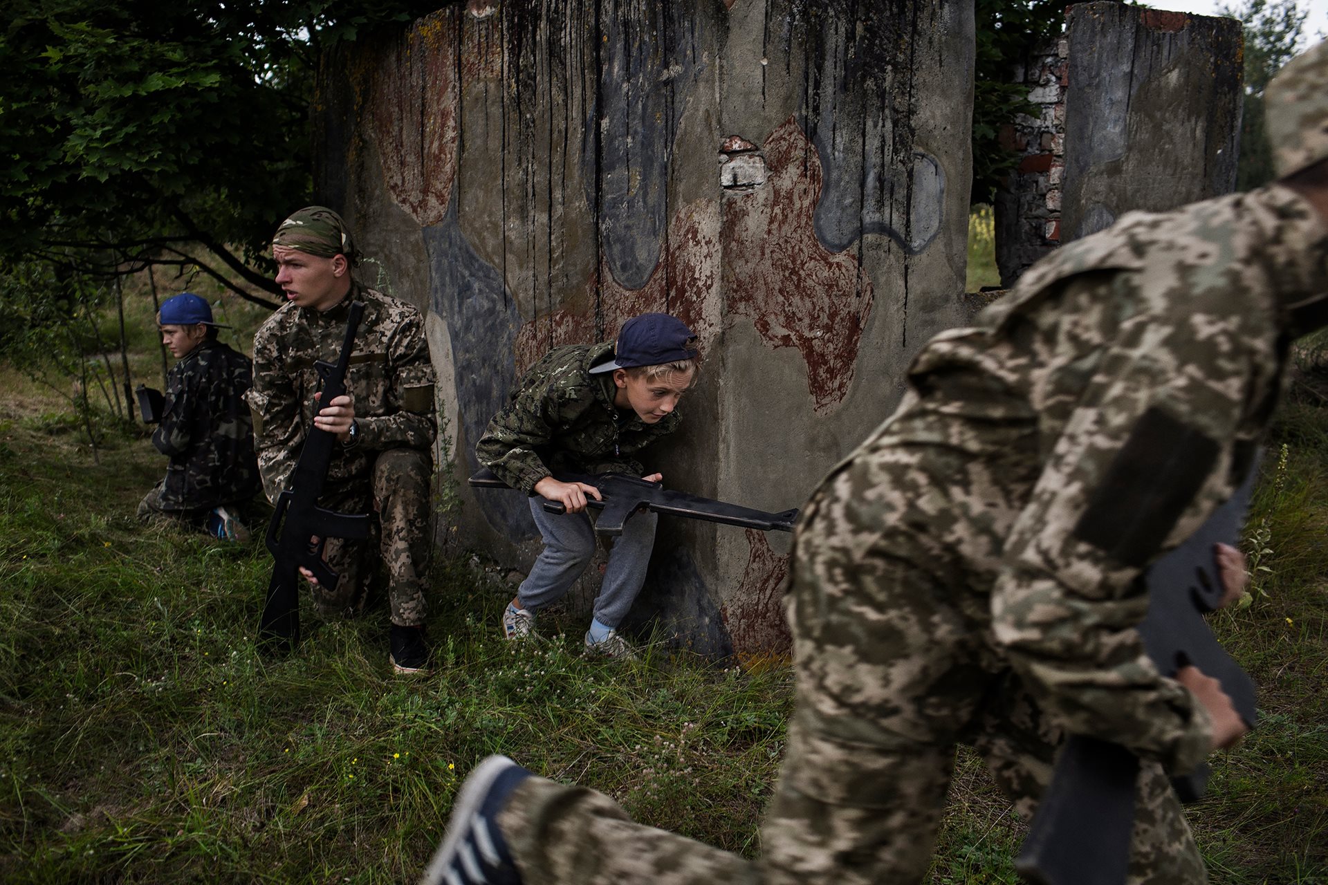 Ukrainian children train in military exercises at Ranger Camp in Volodymyr-Volynskyy, Ukraine, a youth camp for 12- to 17-year-olds founded in 2017.