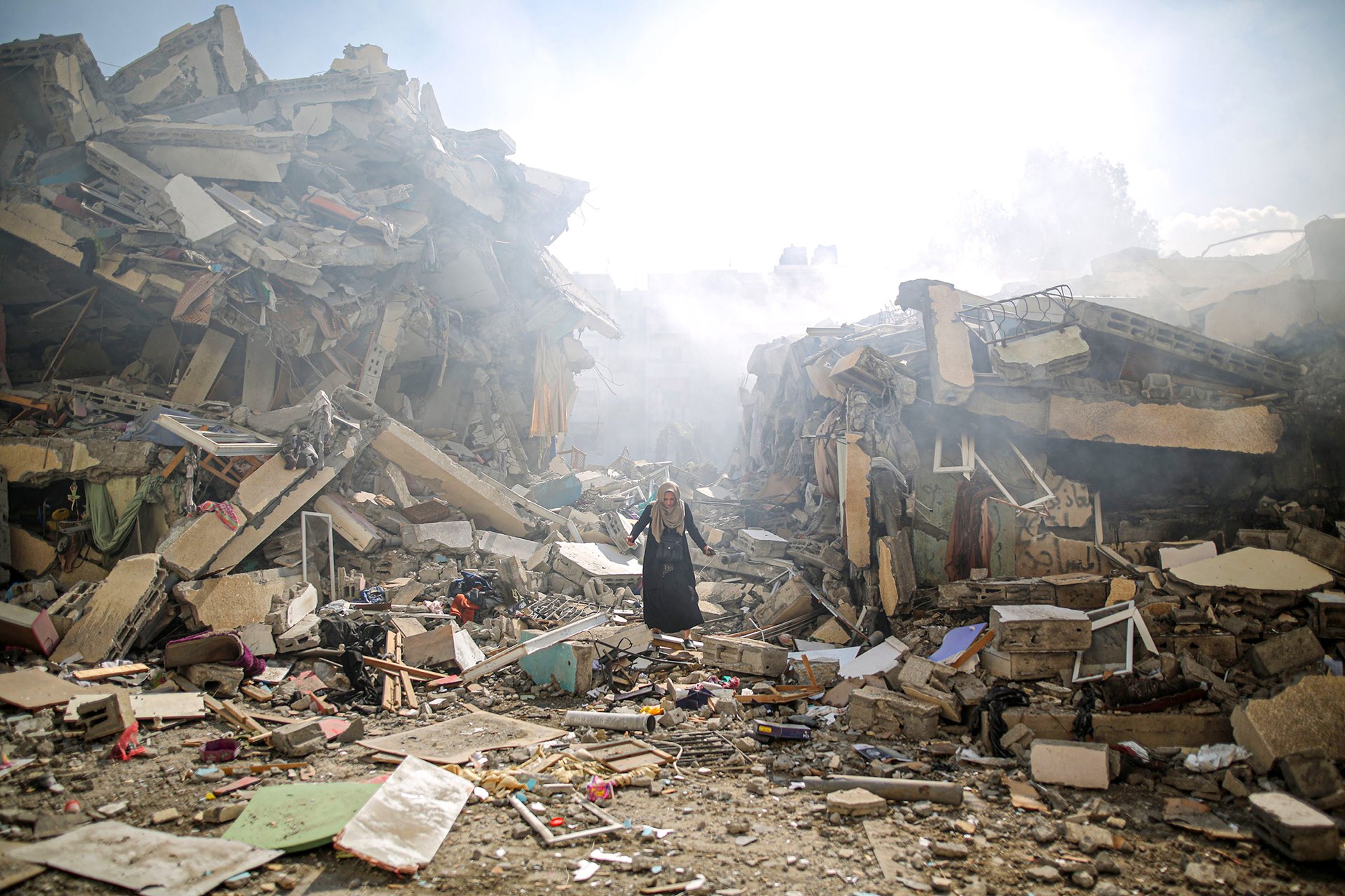 A resident of al-Zahra walks through the rubble of homes destroyed in Israeli airstrikes. The strikes hit around 25 apartment blocks in the university and residential neighborhood. At the time of writing (4 March 2024), Israel&rsquo;s attacks on the occupied Palestinian territories during the Israel-Hamas war had killed some 30,000 people and injured more than 70,000. Gaza City, Gaza.