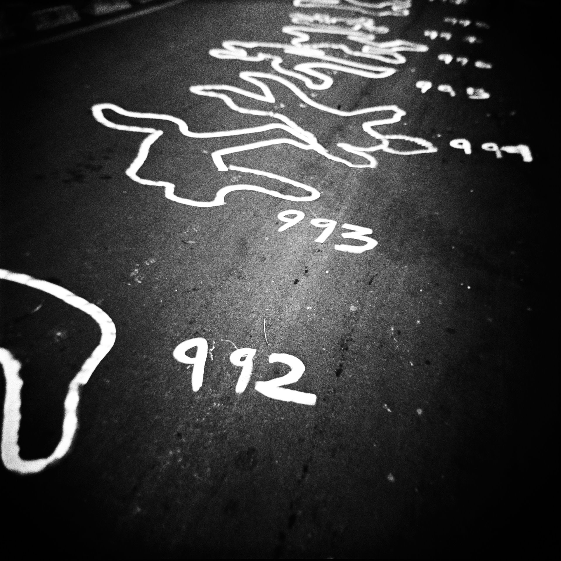 Silhouettes of bodies lie drawn on the streets of Bogotá in protest against the so-called &lsquo;false positives&rsquo; scandal, in which security forces, in order to receive promotion or other benefits, lured vulnerable people to remote areas with the offer of work, killed them, and passed them off to authorities as guerrillas, to boost combat kill rates. According to a UN special rapporteur on extrajudicial executions, examples of such killings date back to the 1980s, although nearly 80 percent of them took place between 2000 and 2008. The Special Jurisdiction for Peace (JEP) records that 6,402 people were killed in this manner between 2002 and 2008 alone.
