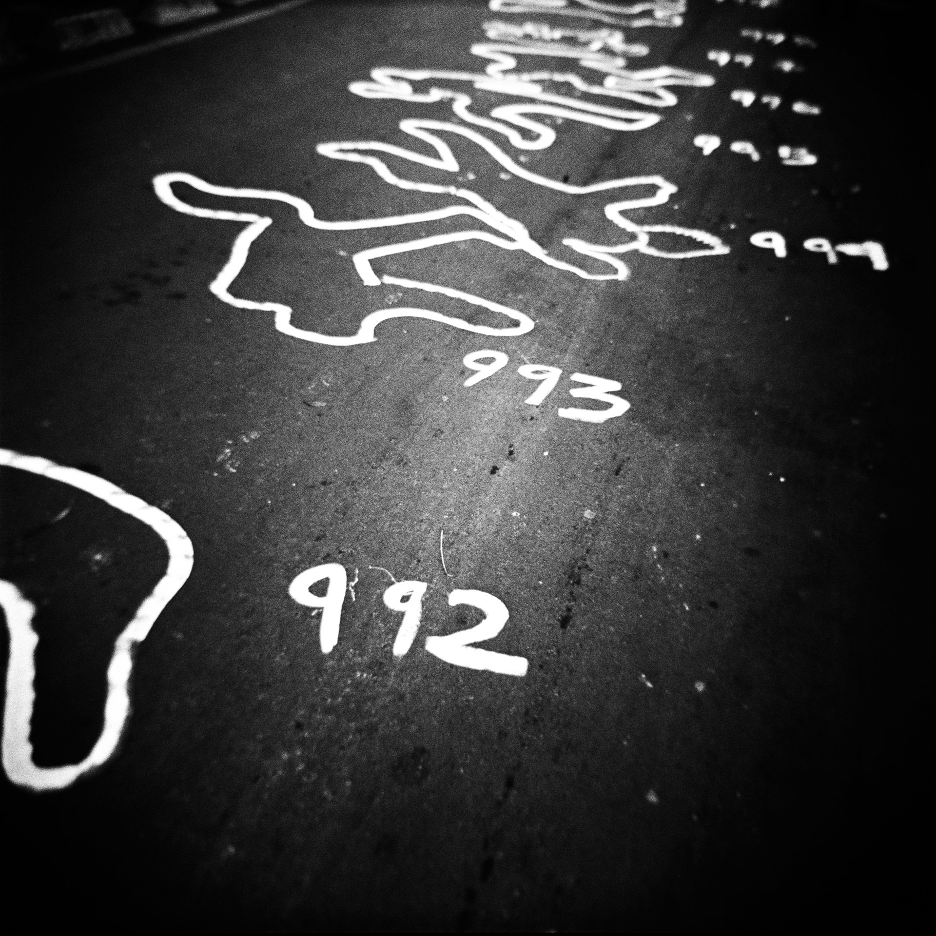 Silhouettes of bodies lie drawn on the streets of Bogotá in protest against the so-called &lsquo;false positives&rsquo; scandal, in which security forces, in order to receive promotion or other benefits, lured vulnerable people to remote areas with the offer of work, killed them, and passed them off to authorities as guerrillas, to boost combat kill rates. According to a UN special rapporteur on extrajudicial executions, examples of such killings date back to the 1980s, although nearly 80 percent of them took place between 2000 and 2008. The Special Jurisdiction for Peace (JEP) records that 6,402 people were killed in this manner between 2002 and 2008 alone.