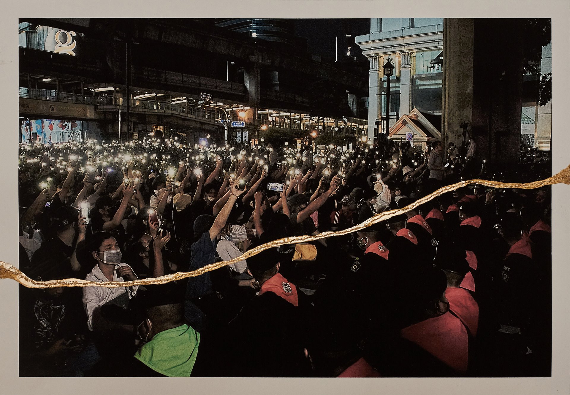 Protesters sing a song and shine the flashlights of their phones in the direction of police officers during a demonstration in Bangkok, Thailand.&nbsp;<br />
<br />
The flashlights symbolize &ldquo;shining the light for democracy.&rdquo; They also fulfill a practical purpose as police cut out public streetlights when there are protests.&nbsp;