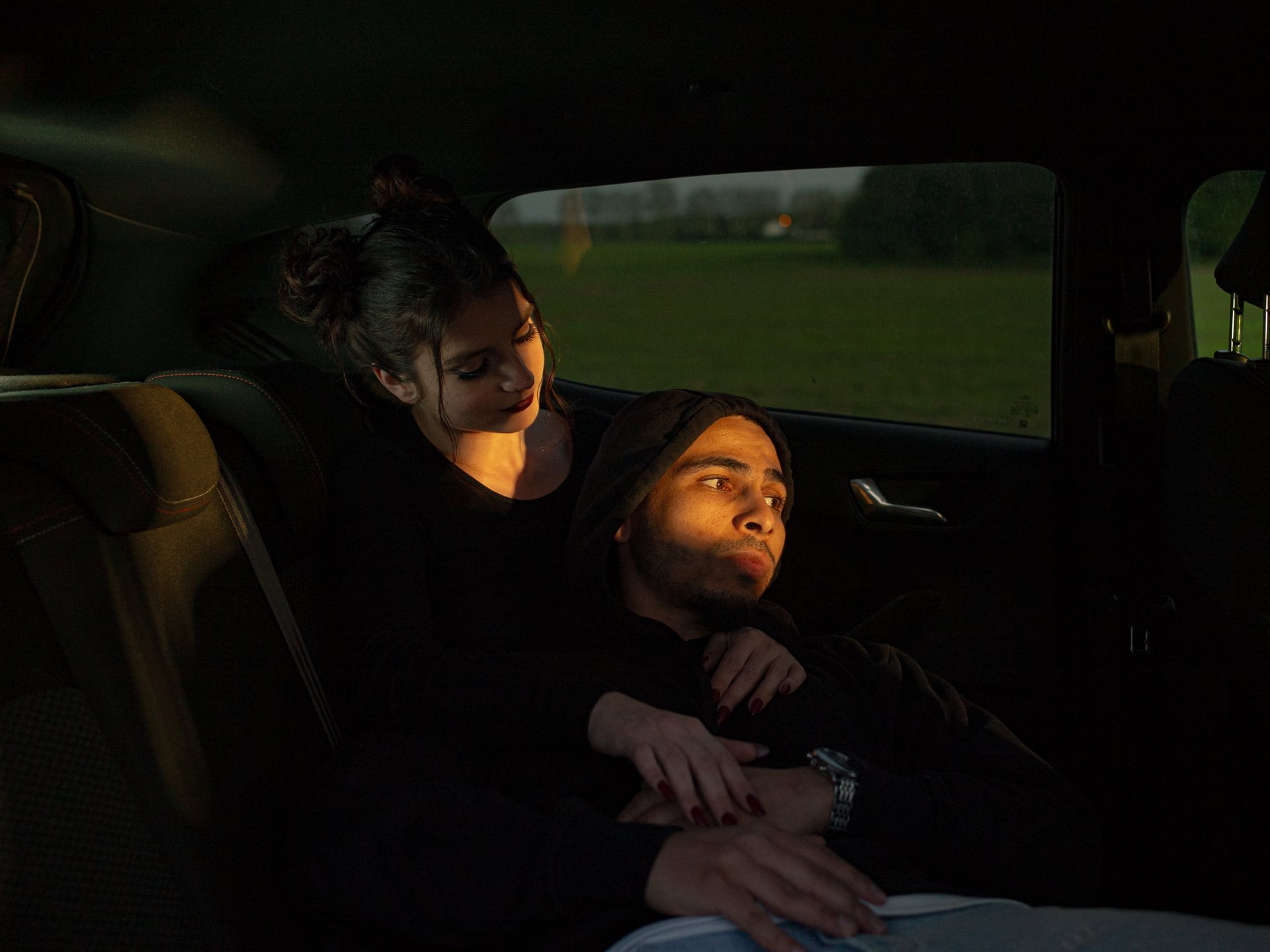 <p>Younes and Sandra embrace in a car close to Villepinte in Seine-Saint-Denis, France.&nbsp;</p>
<br />
&nbsp;