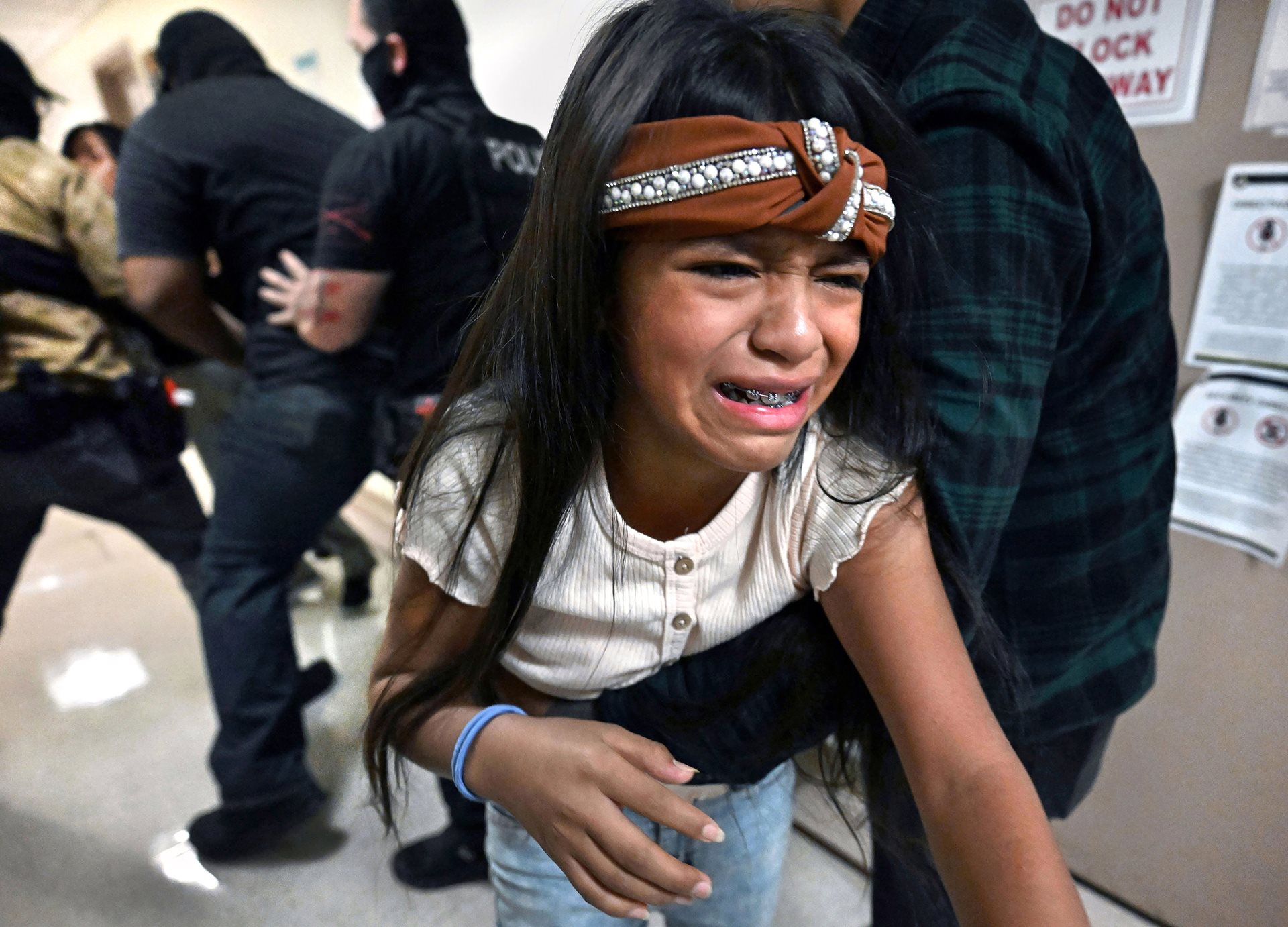 <p>Rosa (12) is pulled away from her father, Ruben. Between 2017 and 2021, over 4,600 children were separated from their parents; at least 1,360 children have yet to be reunited with their families as of early 2025.&nbsp;New York City, New York, United States&nbsp;</p>
