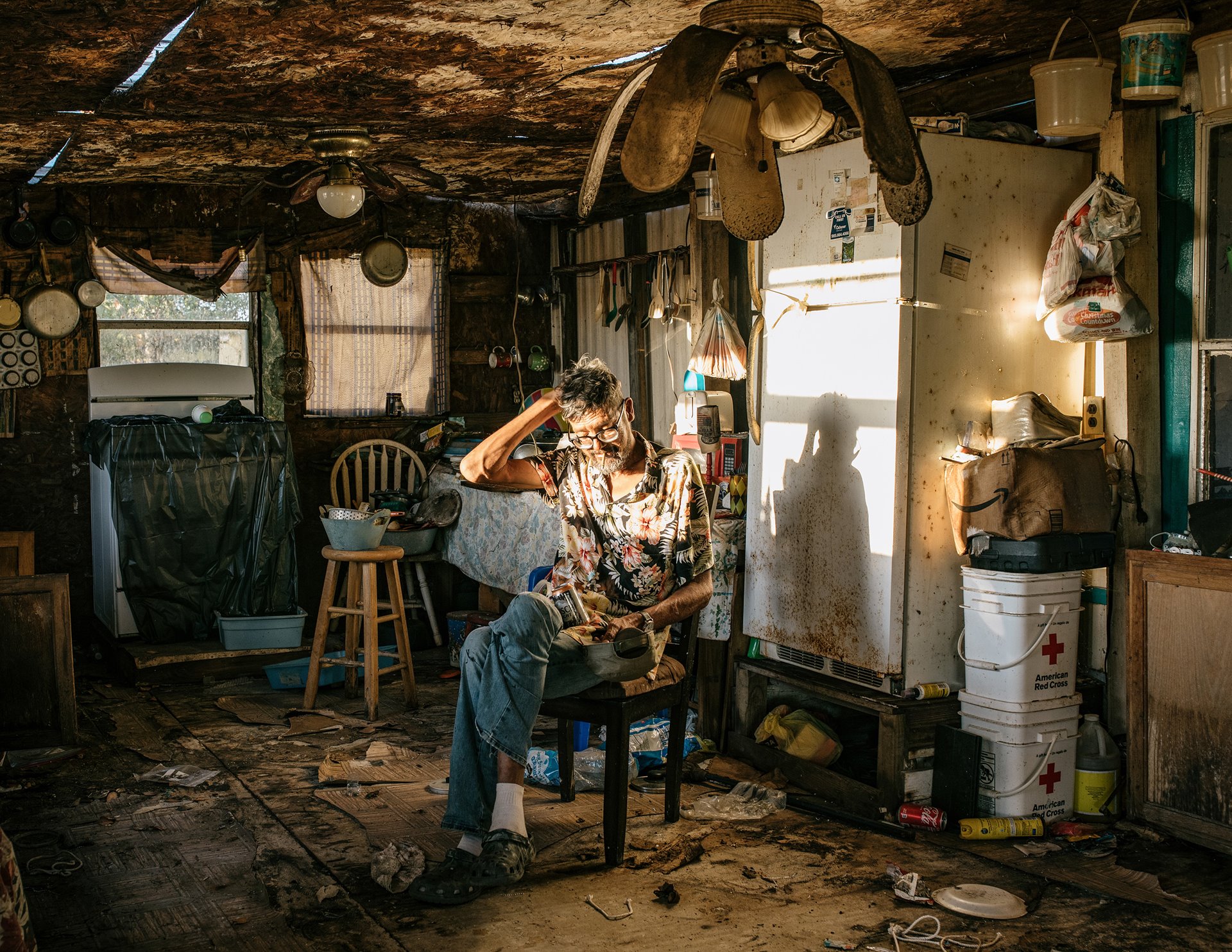 Out of habit, Roger Naquin still spends afternoons in Uncle Freddy&rsquo;s house, which has been infested with mold since Hurricane Ida. Roger and Freddy Naquin live in caravans in nearby Pointe-aux-Chênes on the mainland and are not eligible for relocation funds. Pointe-aux-Chênes, Louisiana, United States.