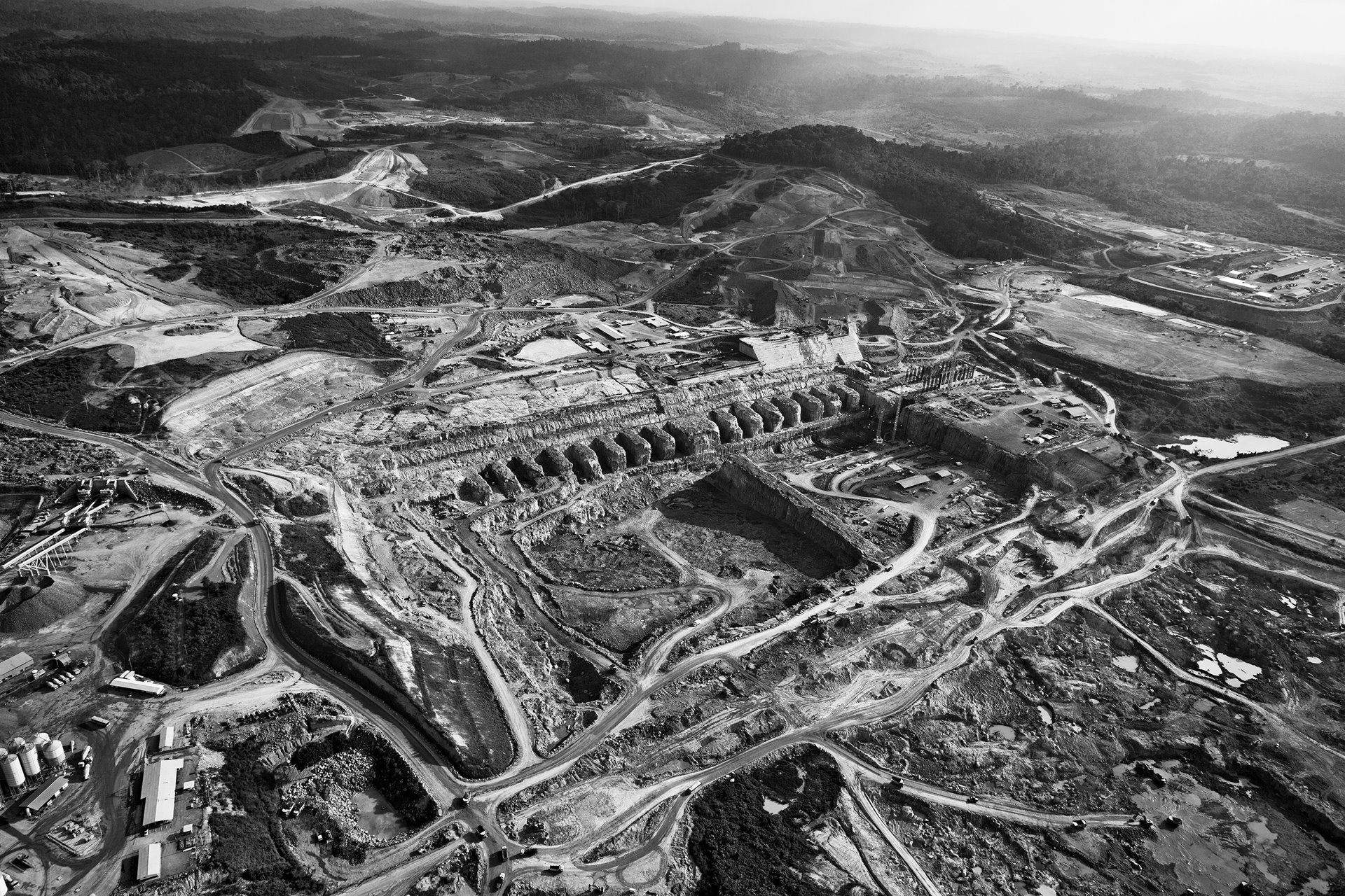 An aerial view of the construction of the Belo Monte Dam on the Xingu River, Altamira, Pará, Brazil. More than 80% of the river&#39;s water has been diverted from its natural course to build the hydroelectric project. The drastic reduction in water flow has an adverse impact both on the environment and on the livelihoods of traditional communities living downstream of the dam.