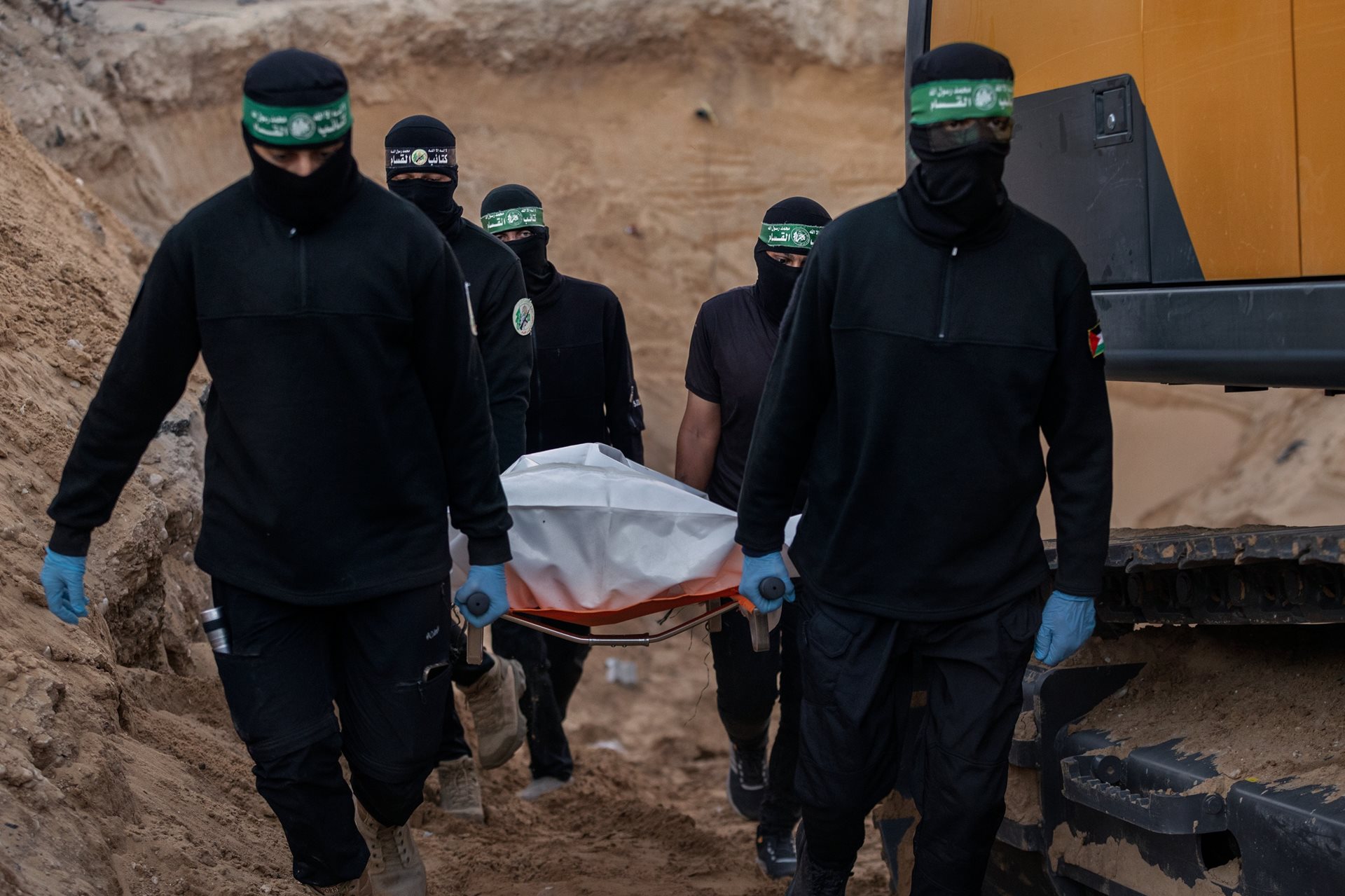 Members of Hamas carry what are believed to be the remains of an Israeli hostage in Khan Younis, Gaza Strip. Following the ceasefire agreement, Hamas returned all 20 living hostages and 28 bodies.