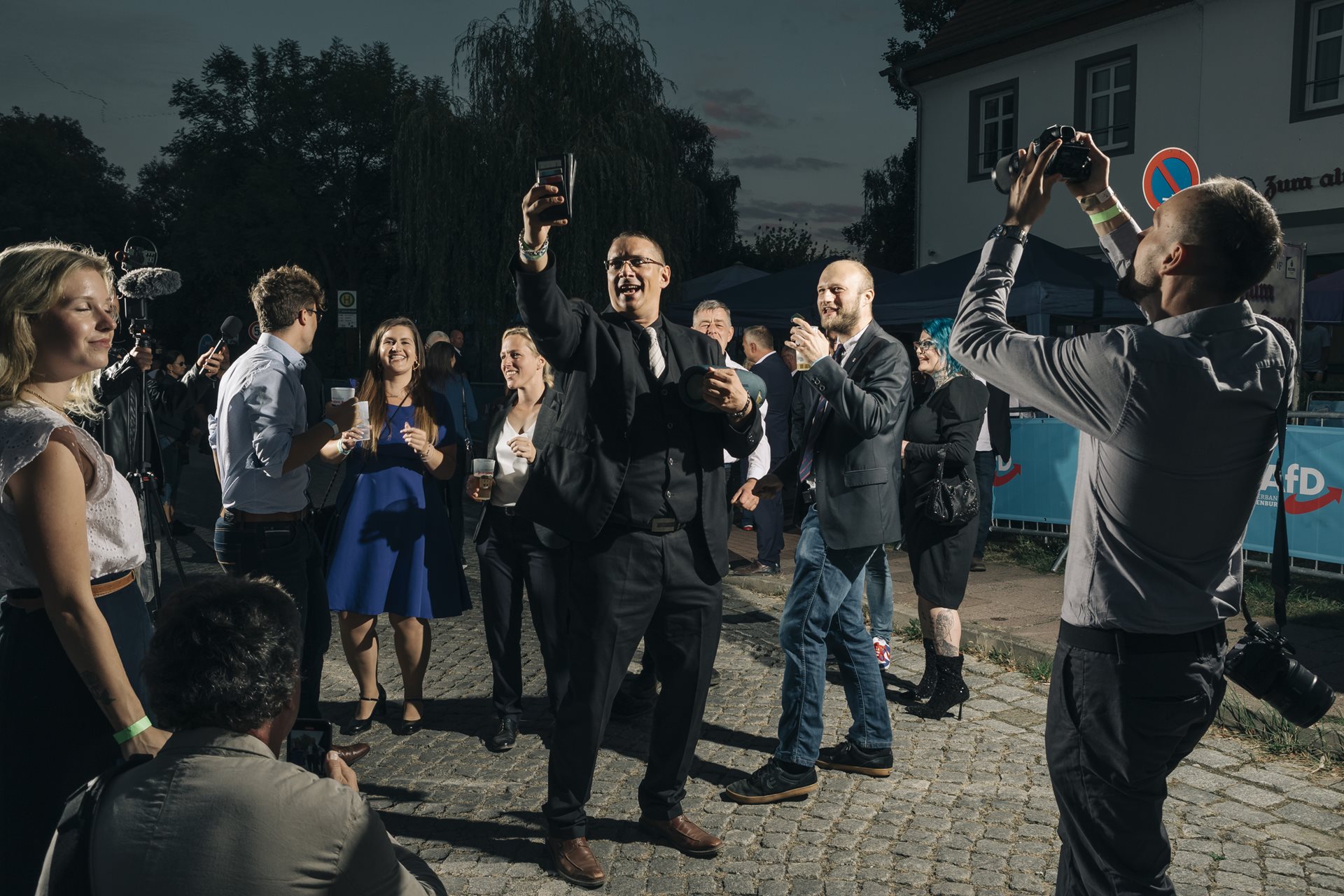 AfD party members and supporters sing a song with rewritten lyrics about deportation in an incident investigated by the police for incitement to hatred, in Potsdam, Germany.