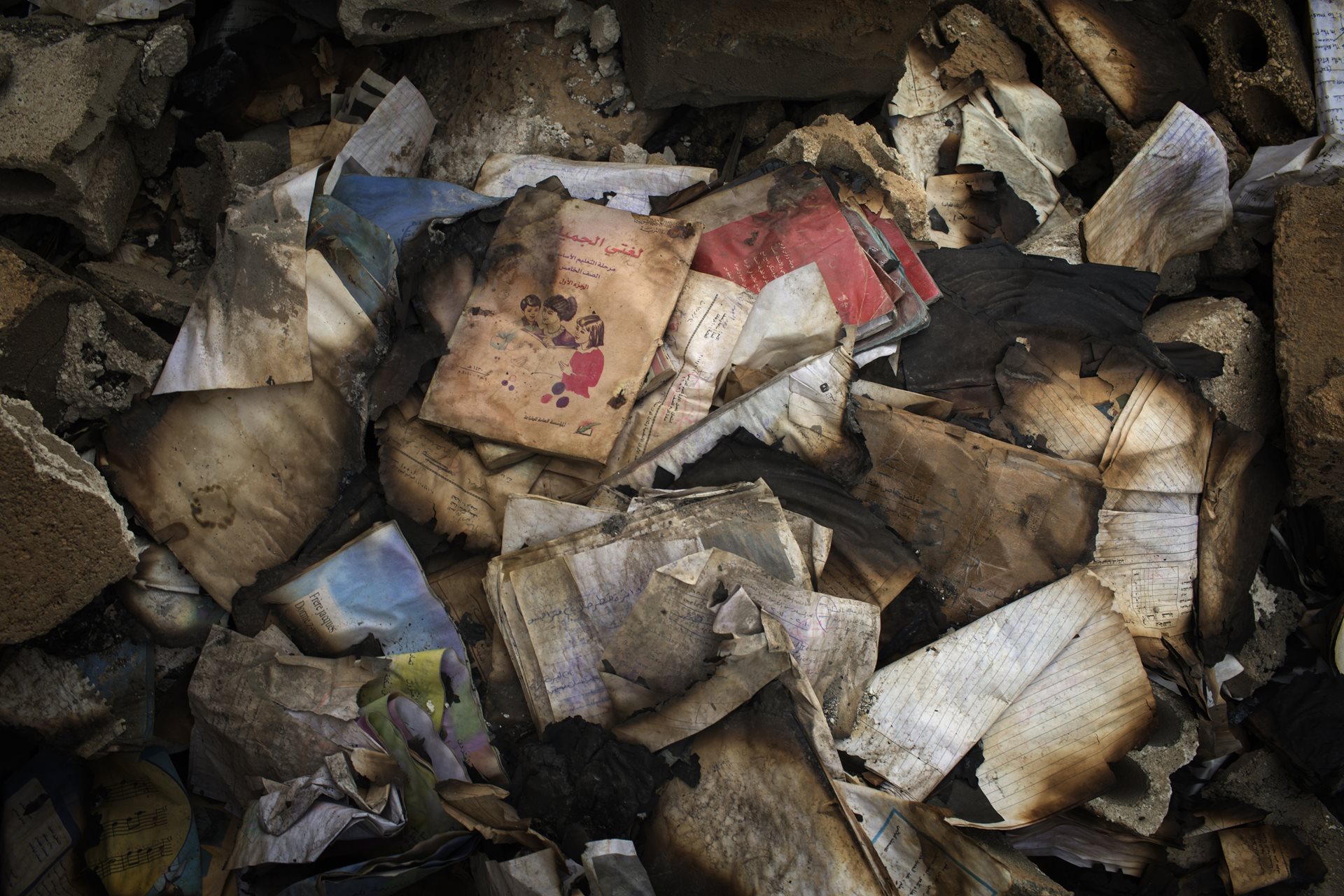Hundreds of textbooks burned by ISIS extremists inside Hani Hakuf&rsquo;s School. At least a quarter of Syrian schools have been damaged or destroyed. Al-Shaddadi, Syria.