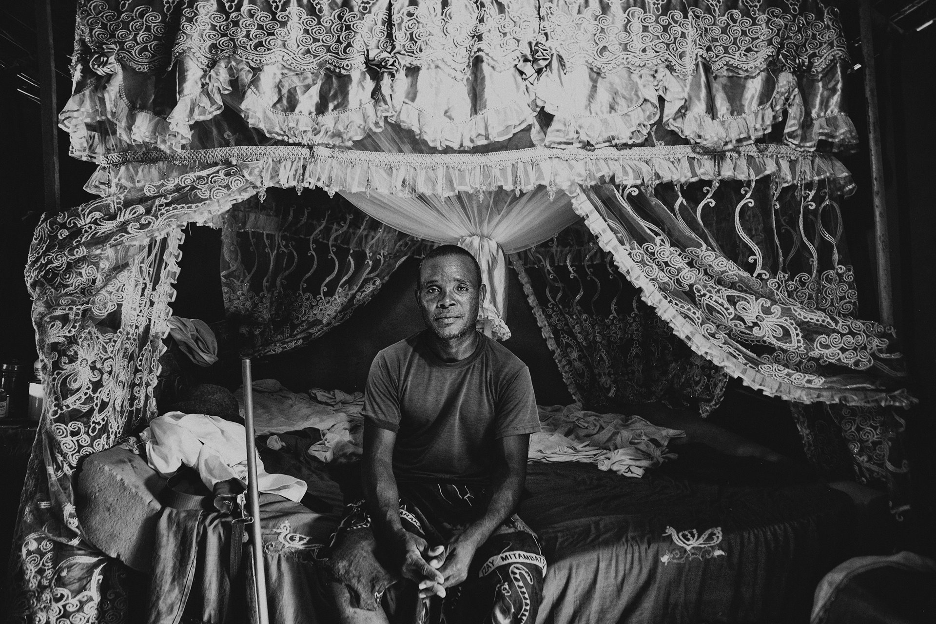 <p>Jean Maximis Nonon sits in his bedroom in Mataviakoho, North Menabe, Bongolava, Madagascar. Military authorities see Nonon as one of the most dangerous dahalo leaders in the region. He is said to own nearly 2,000 cattle and to be able to assemble 200 men on operations to steal zebu. Nonon refuses to be considered a dahalo. He justifies the villagers&rsquo; possession of arms as a means to protect themselves from other dahalo coming from the south of Menabe who, according to him, harass the village.</p>
