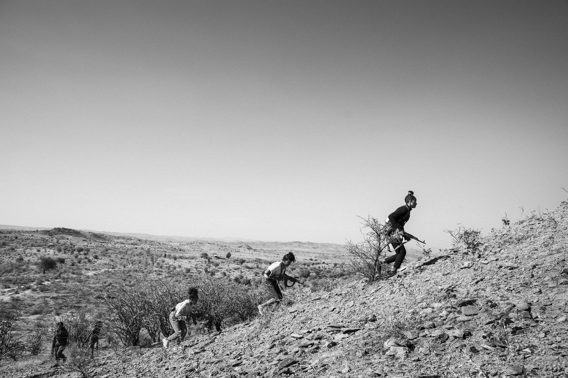 A group of Tigrayan soldiers engages in a military exercise in in Tzada Medri, Tigray, Ethiopia, near the Eritrean border. After only twenty days of intensive training, women are sent to the front lines.