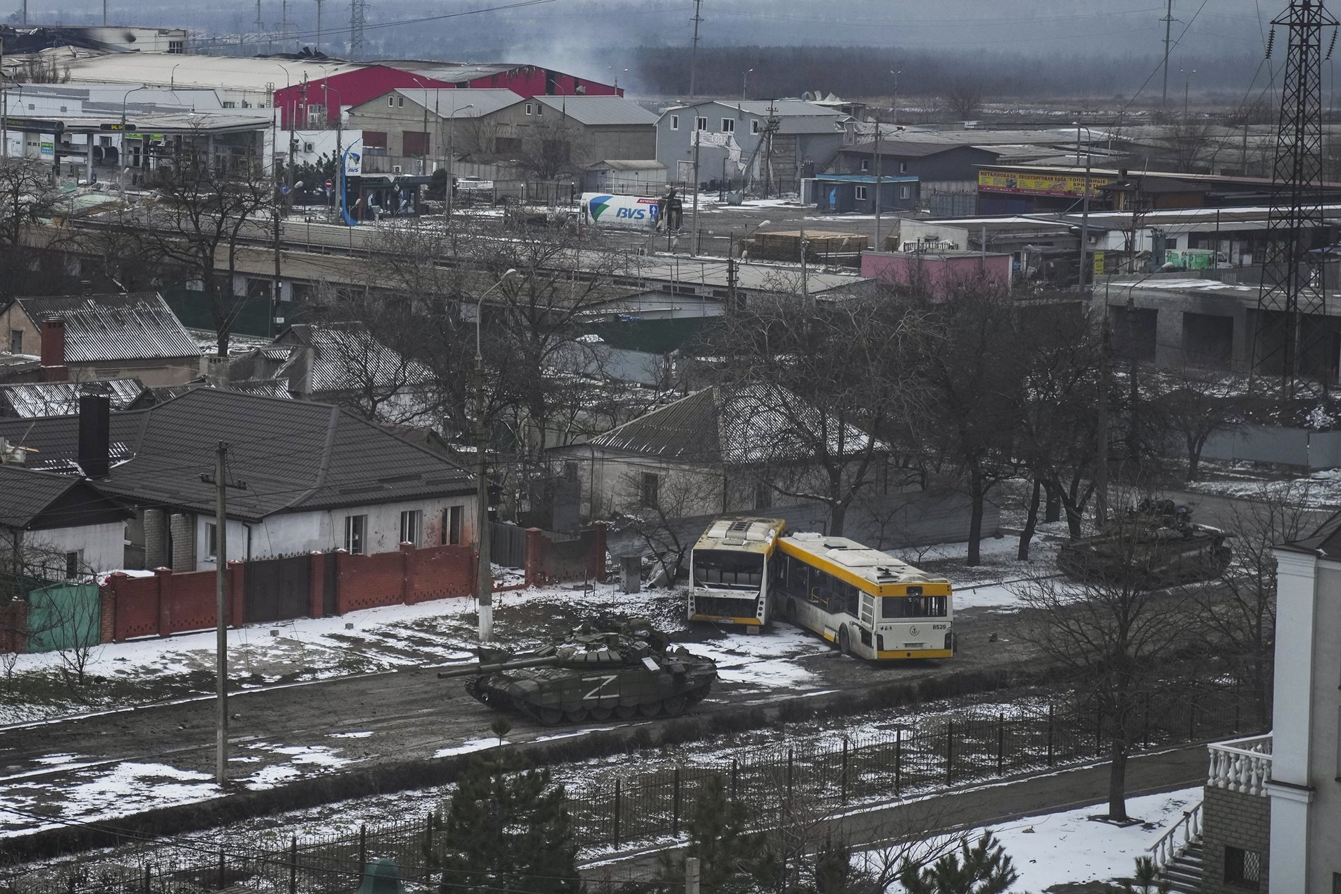<p>Russian army tanks move through a street on the outskirts of Mariupol. The Z marking is one of several symbols painted on Russian military vehicles in the early stages of the invasion.</p>
