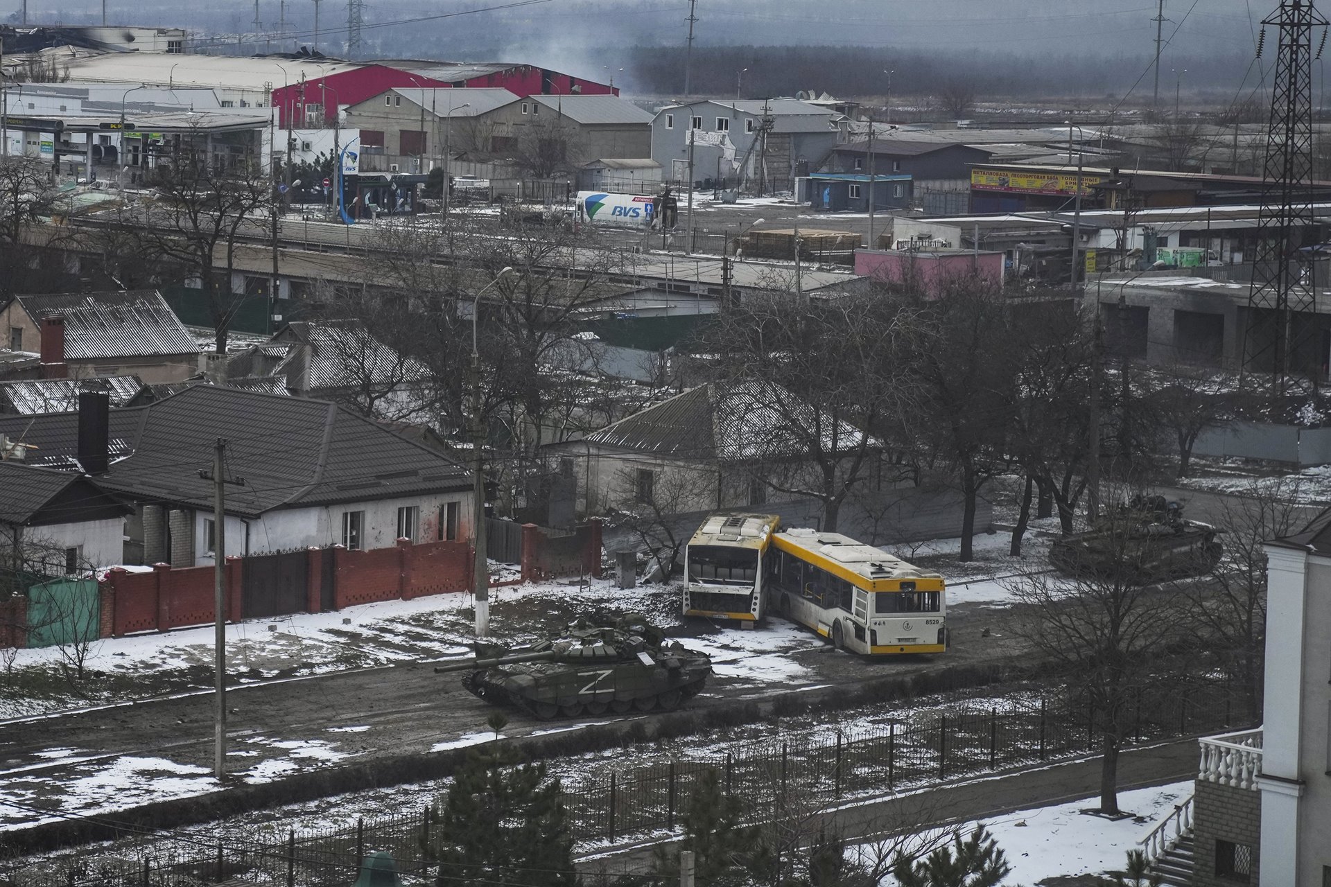 <p>Russian army tanks move through a street on the outskirts of Mariupol. The Z marking is one of several symbols painted on Russian military vehicles in the early stages of the invasion.</p>
