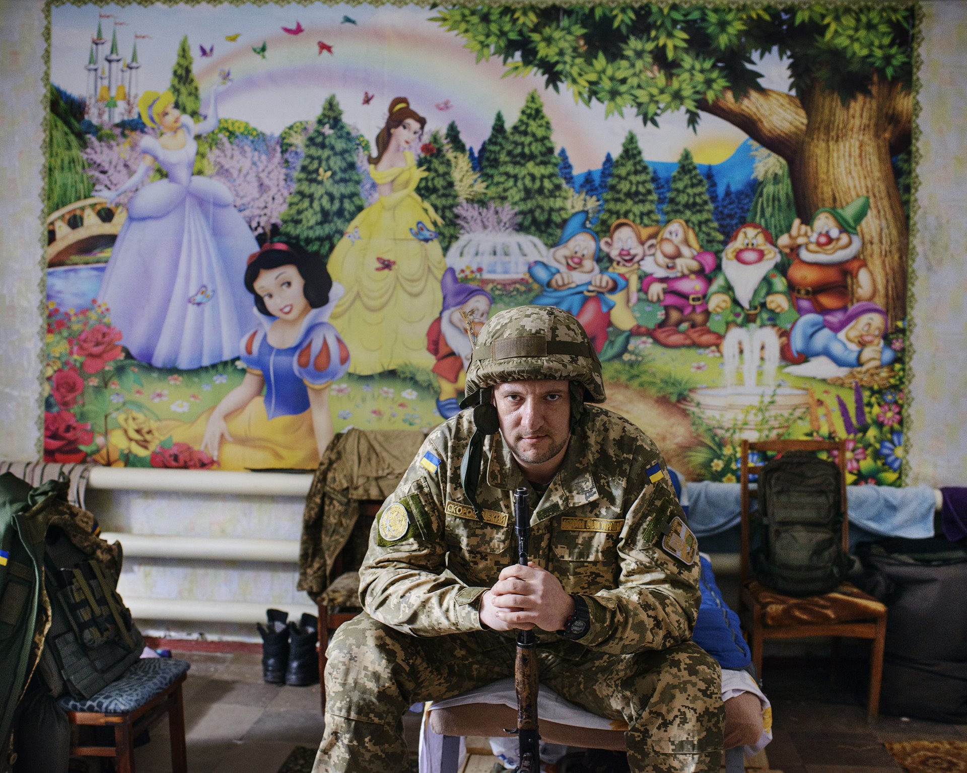 Volodymyr, a press officer with the Ukrainian Armed Forces, poses in the dormitory of the military press bureau of the 72nd Brigade, in what was once a child-care center, in Avdiivka, Donbas, Ukraine. The Ukrainian army successfully defended the city from separatist forces.