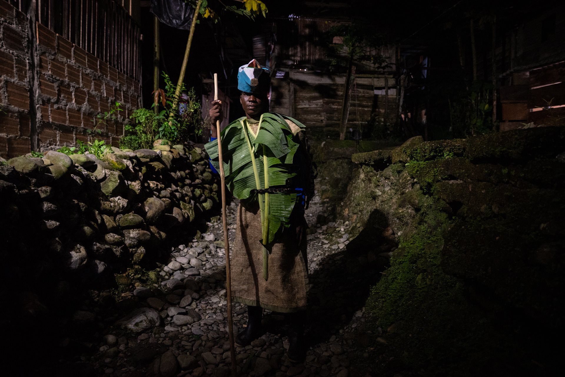 Eider Calimeño is one of 33 men who act as Matachín: those who commit to participating in the Fiesta de los Manacillos. This ancestral responsibility is passed down through male lineage, requiring participants to return to Juntas every Holy Week to preserve their heritage. Juntas, Buenaventura, Colombia.