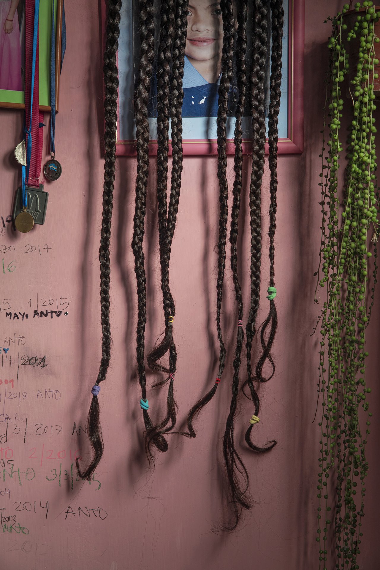 Antonella&rsquo;s hair decorates her room, waiting to be donated for a wig for a person with cancer.