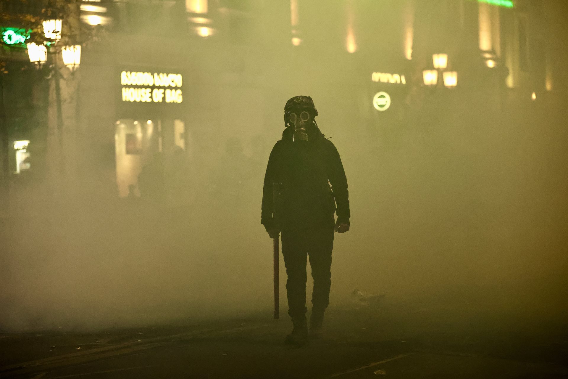 Rustaveli Avenue, which runs past the Parliament of Georgia in Tbilisi, lies covered by smoke, after police deployed tear gas against protesters. Demonstrators tried to take shelter in nearby alleys.