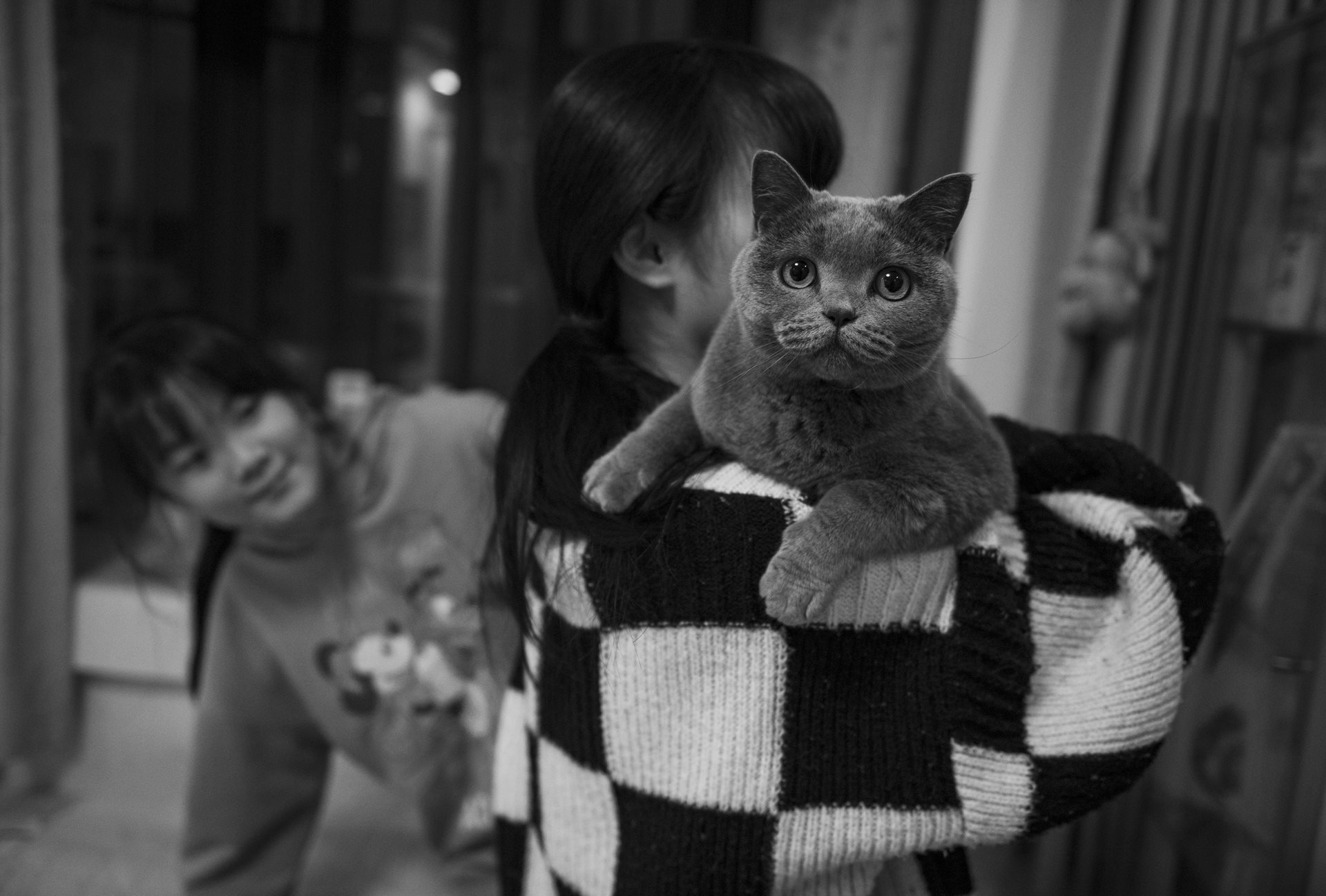 Huihui holds her pet cat in their home in Hefei, Anhui Province, China.