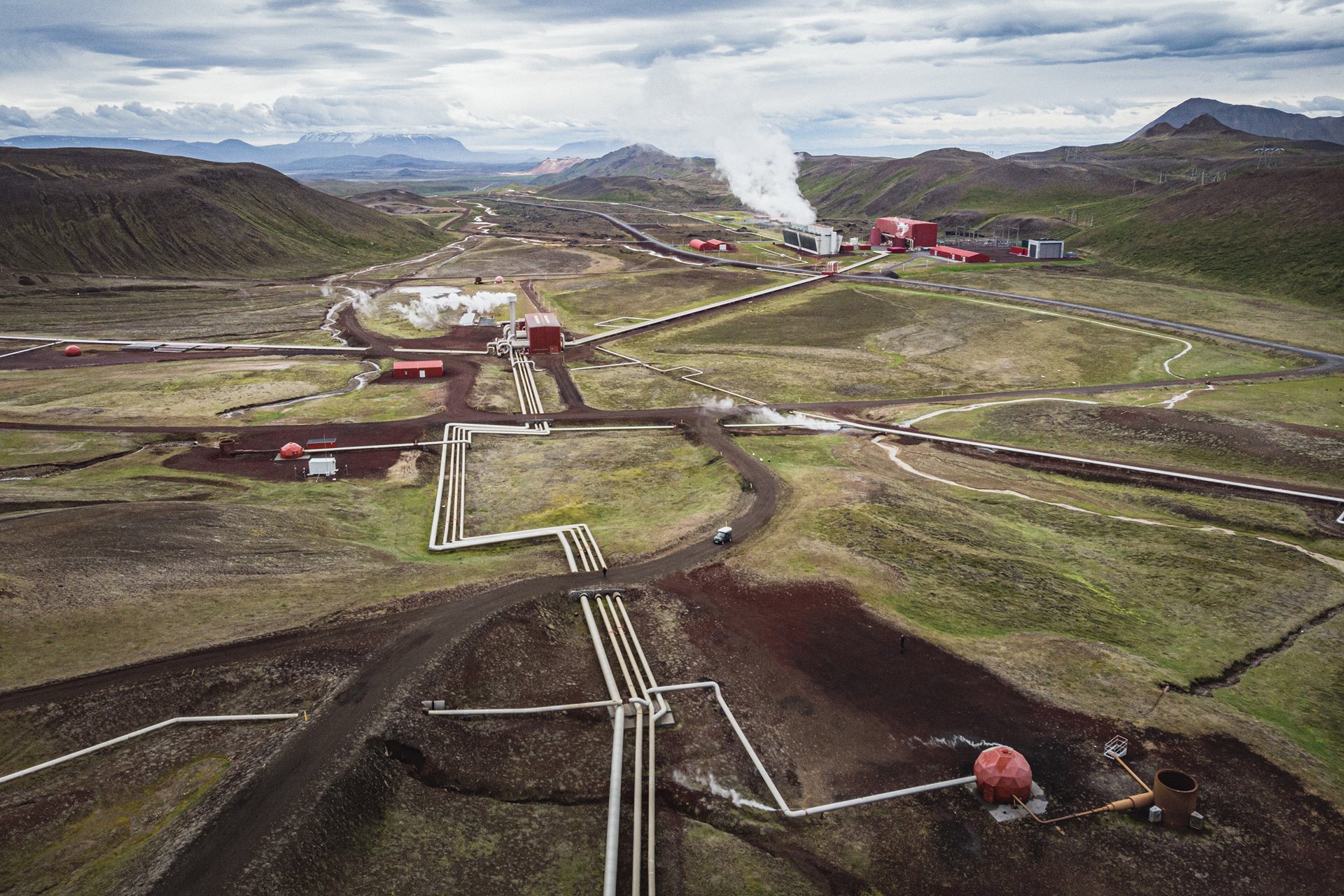 <p>Carbon emissions from a geothermal power station, in Krafla, Iceland, are reinjected into geothermal wells to minimize their environmental impact.&nbsp;</p>

<p>Geothermal power plants draw fluids from underground reservoirs to the surface to produce steam, which then drives turbines to generate electricity. The process is not emissions-free, as the remaining fluids contain harmful condensates, but the plant injects these back into deep bedrock, where the CO2 can turn rapidly into minerals. Geodesic domes cover the boreholes and equipment, reducing the visual impact on the environment. In 2020, this plant fixed over 50,000 tonnes of CO2 in this way. Such carbon fixing remains a controversial issue, with critics saying that the technologies distract from the pressing need to reduce carbon emissions rather than capturing them.</p>
