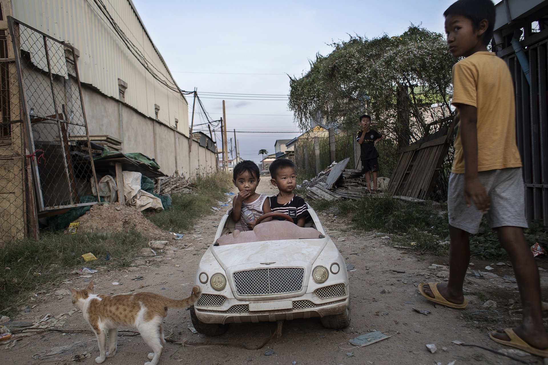 Chandarayoth Pheap (3, right) plays with his cousin at his mother Sreyroth&rsquo;s home in Phnom Penh, Cambodia. Chandarayoth often gets into fights with his cousins, struggling for attention in the complicated dynamics of the family.