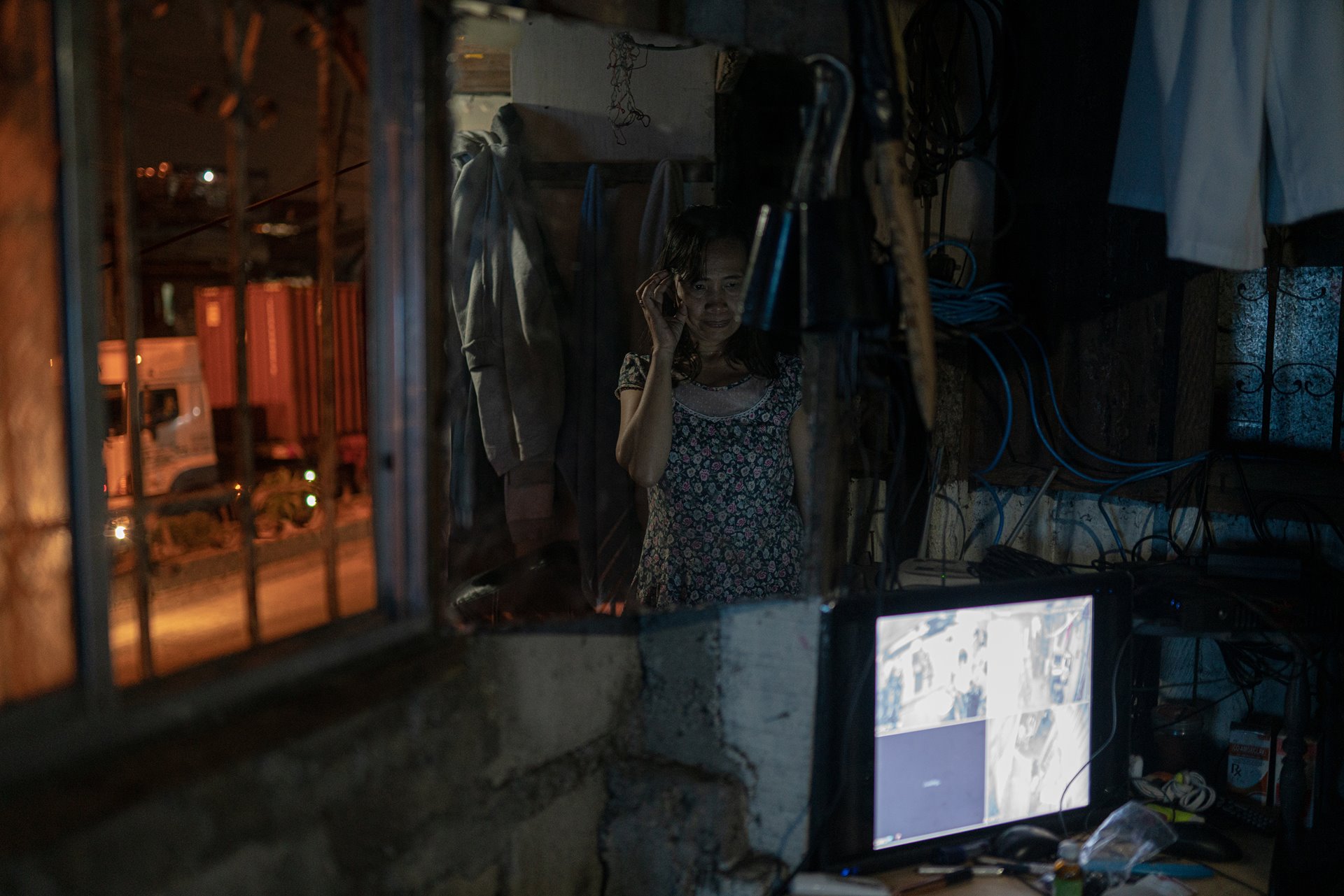 Jovelyn Habal stands beside the CCTV she had installed after her husband was killed by unidentified gunmen outside their house in Binondo, Manila, the Philippines, a year previously. Jovelyn is part of Paghilom (Healing), a program started in 2017 by former drug user Father Flaviano Villanueva for families of victims of the war on drugs, providing them with support and counseling.