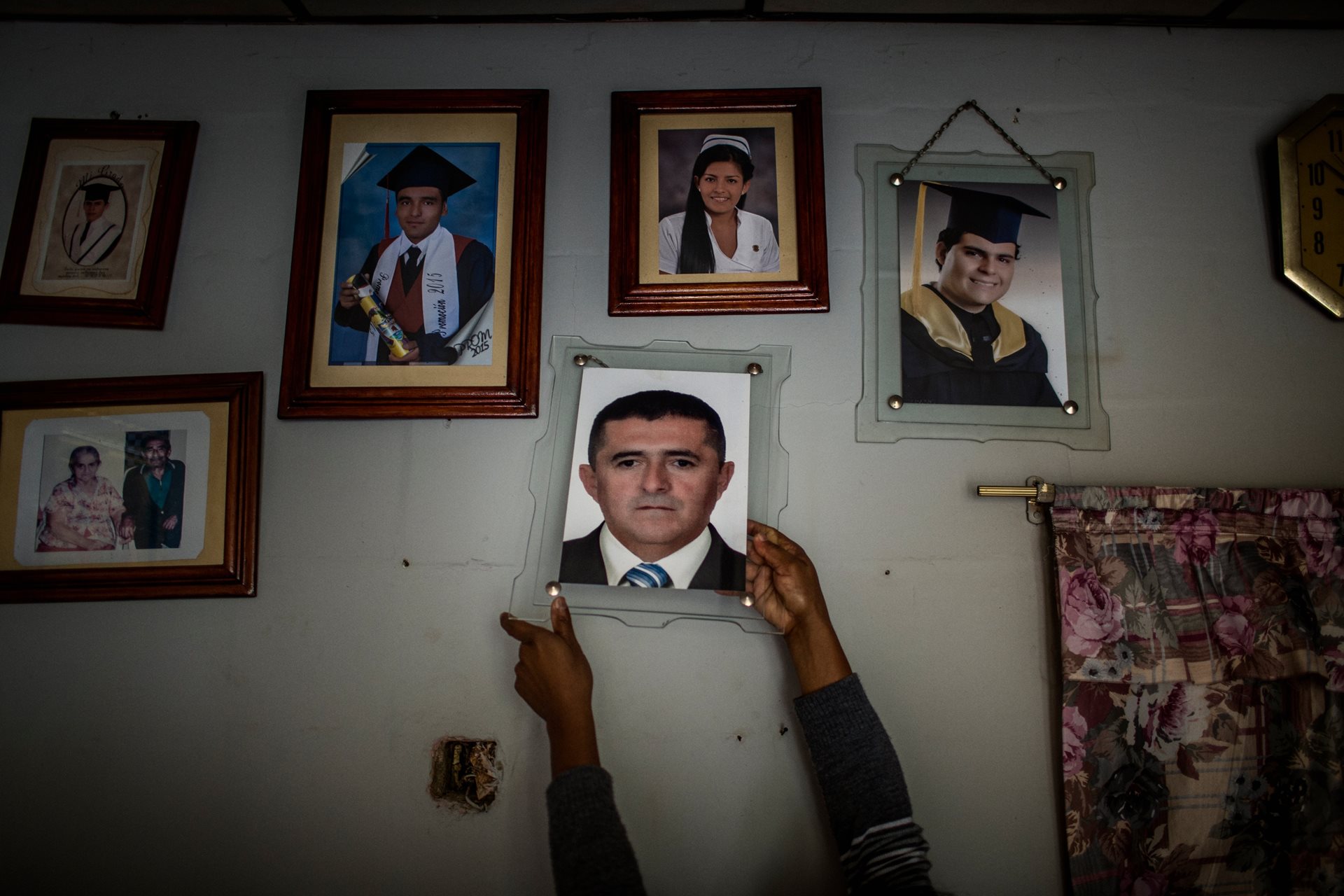 Marisa Celina Méndez holds a photograph of her husband Diego Cenén López Gómez, a teacher killed by an armed man while teaching at Cenegueta school in April 2016. Cauca, Colombia.