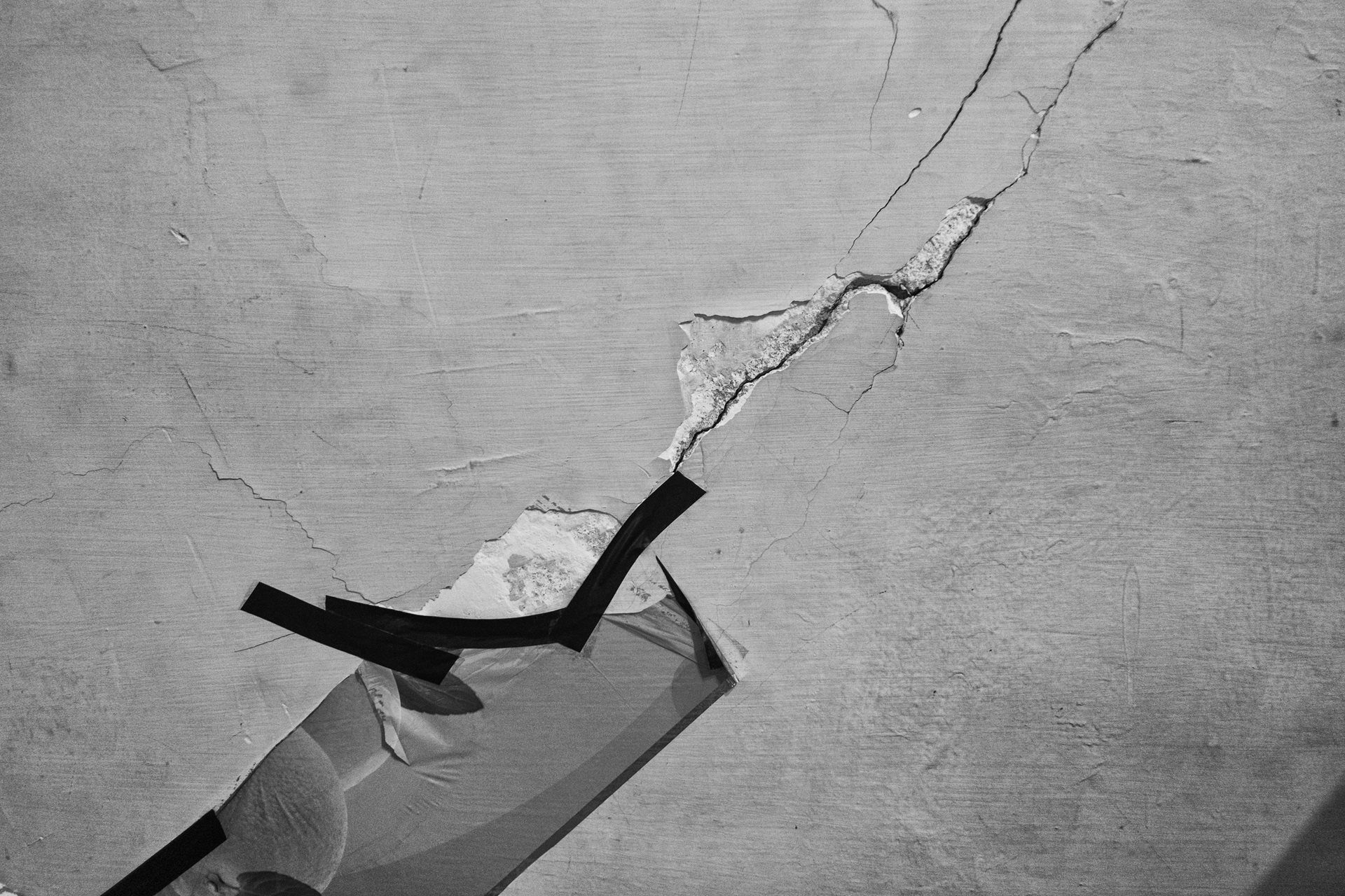 Tape covers a crack caused by factory vibrations. &ldquo;Now we're supposed to buy the cement they&rsquo;re killing us with to repair the house,&rdquo; says Ola, who lives opposite the factory in Moon Valley, Alexandria, Egypt.&nbsp;