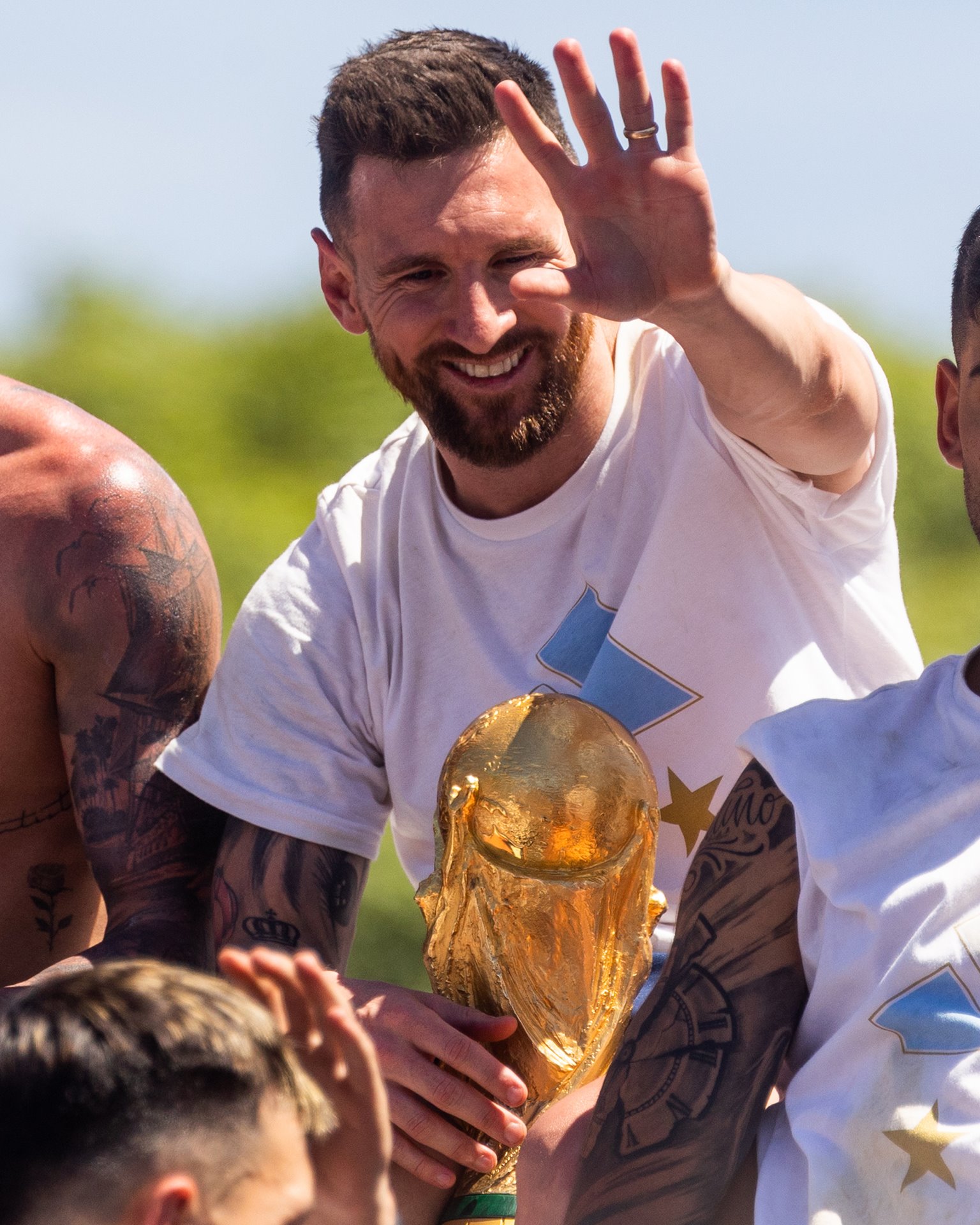 Argentina football star Lionel Messi waves to fans during the victory parade in Buenos Aires, Argentina.